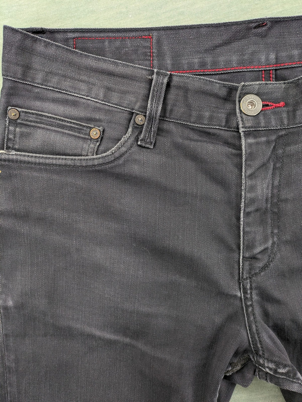 Tommy Hilfiger grey straight jeans faded denim with iconic logo detail.