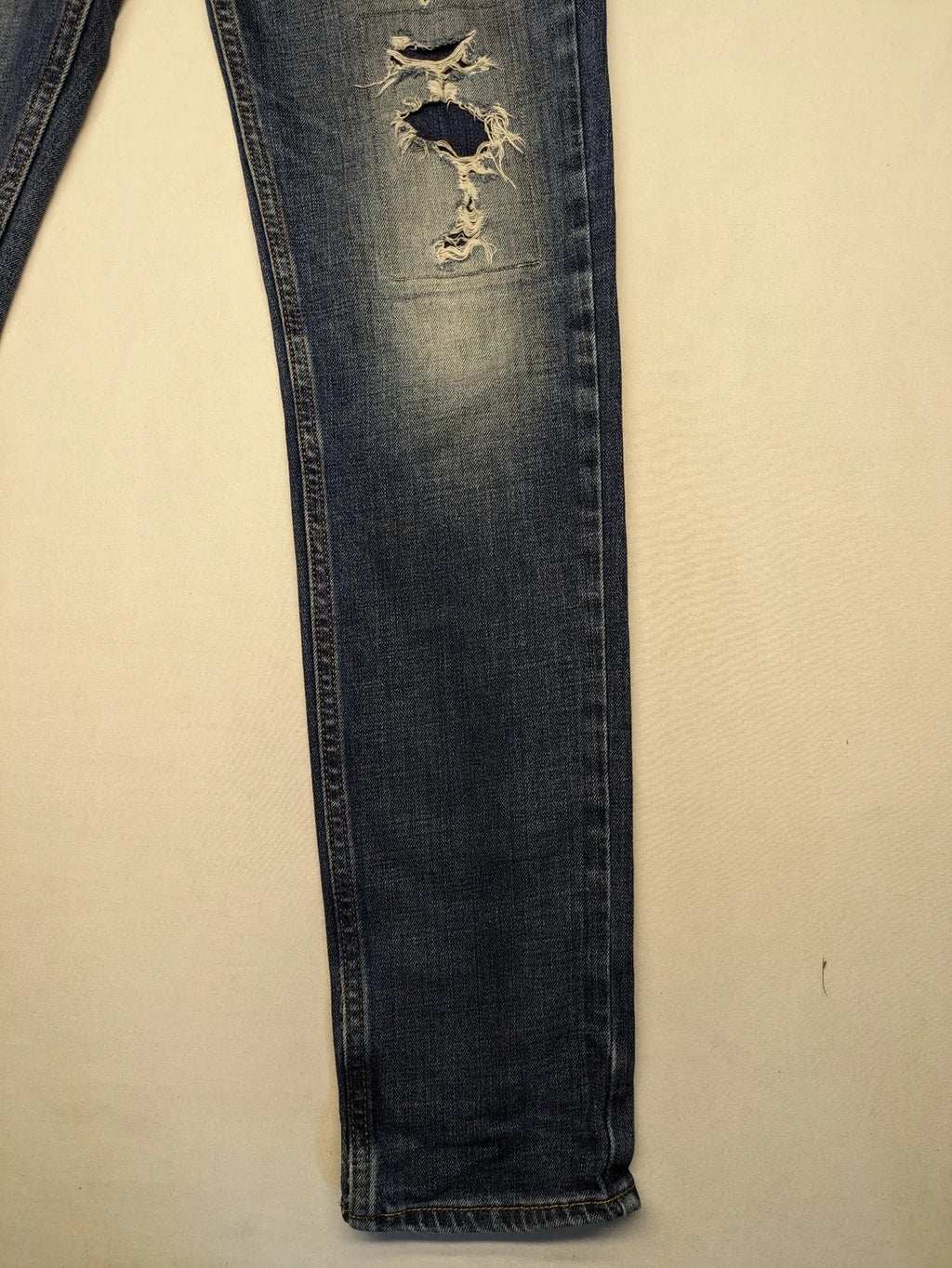 Hollister blue slim fit jeans with distressed detailing and classic button fly.