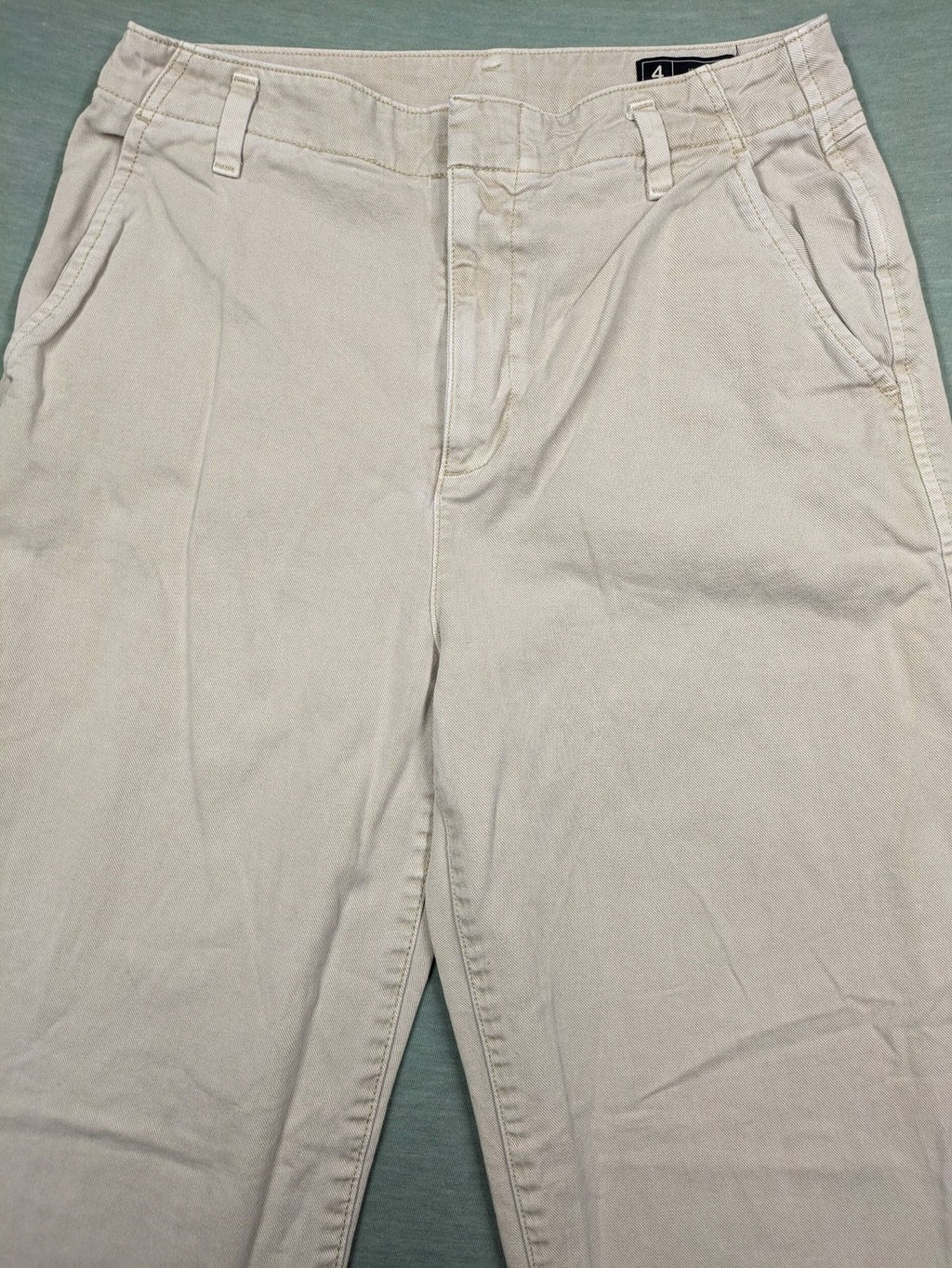 Gap beige loose-fit chino pants made from 100% cotton with relaxed wide-leg design.