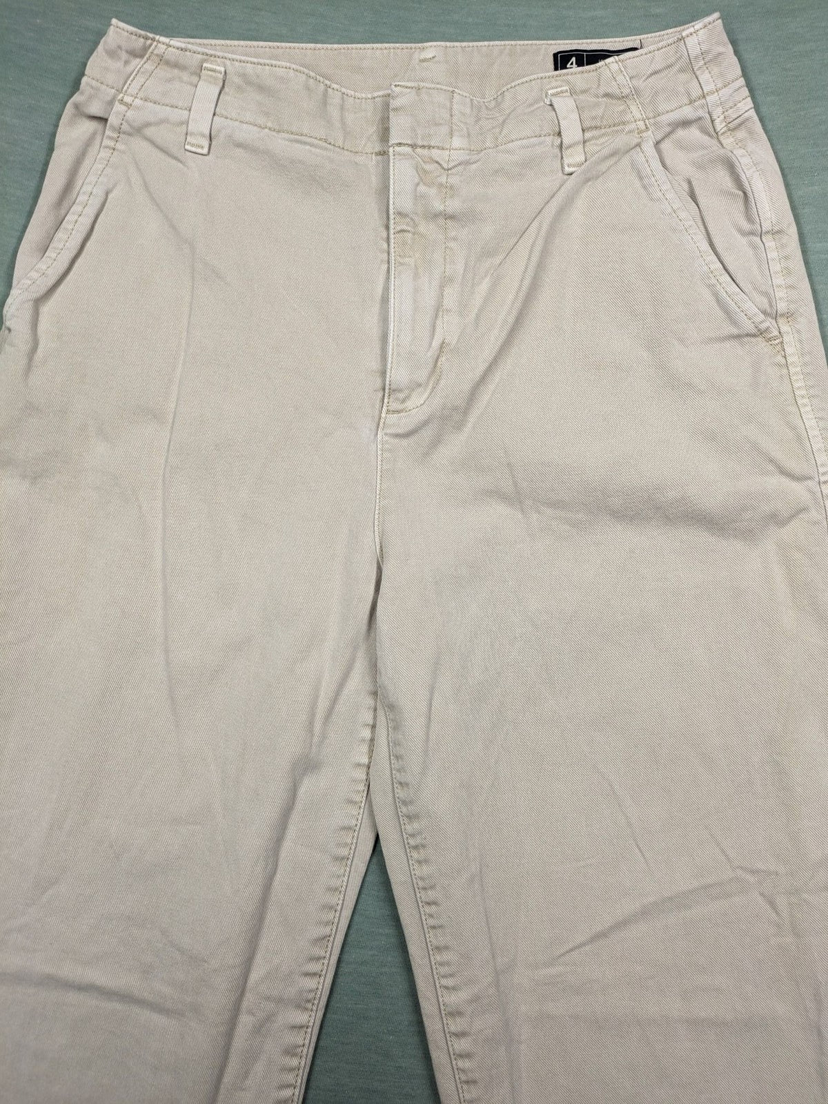 Gap beige loose-fit chino pants made from 100% cotton with relaxed wide-leg design.