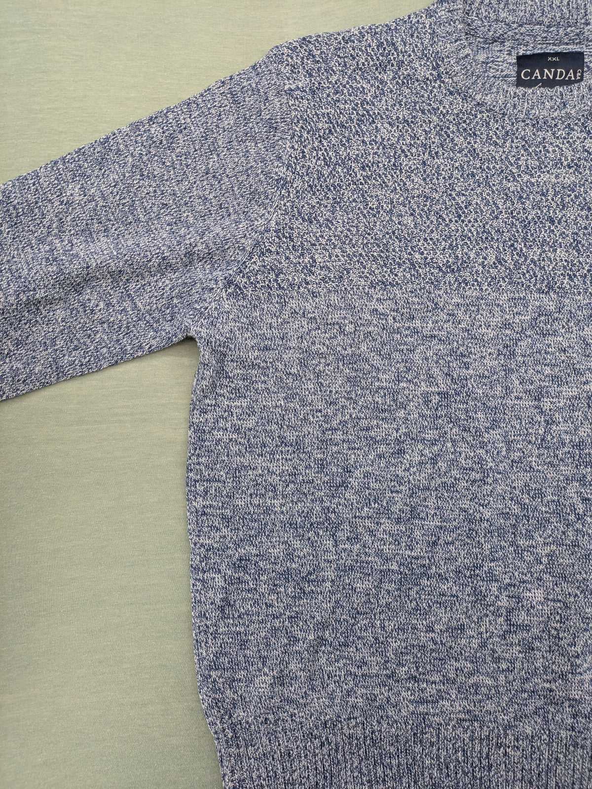 Canda blue-grey melange turtle neck jumper with long sleeves and round neckline.