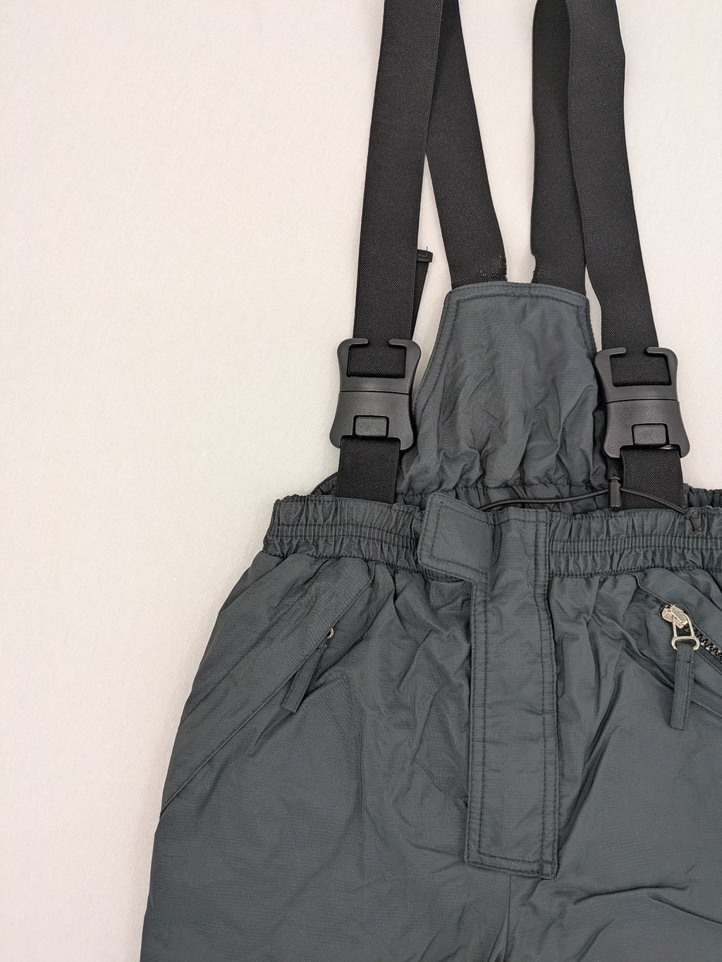 PROLINE grey winter ski pants with adjustable straps and insulated durable material.