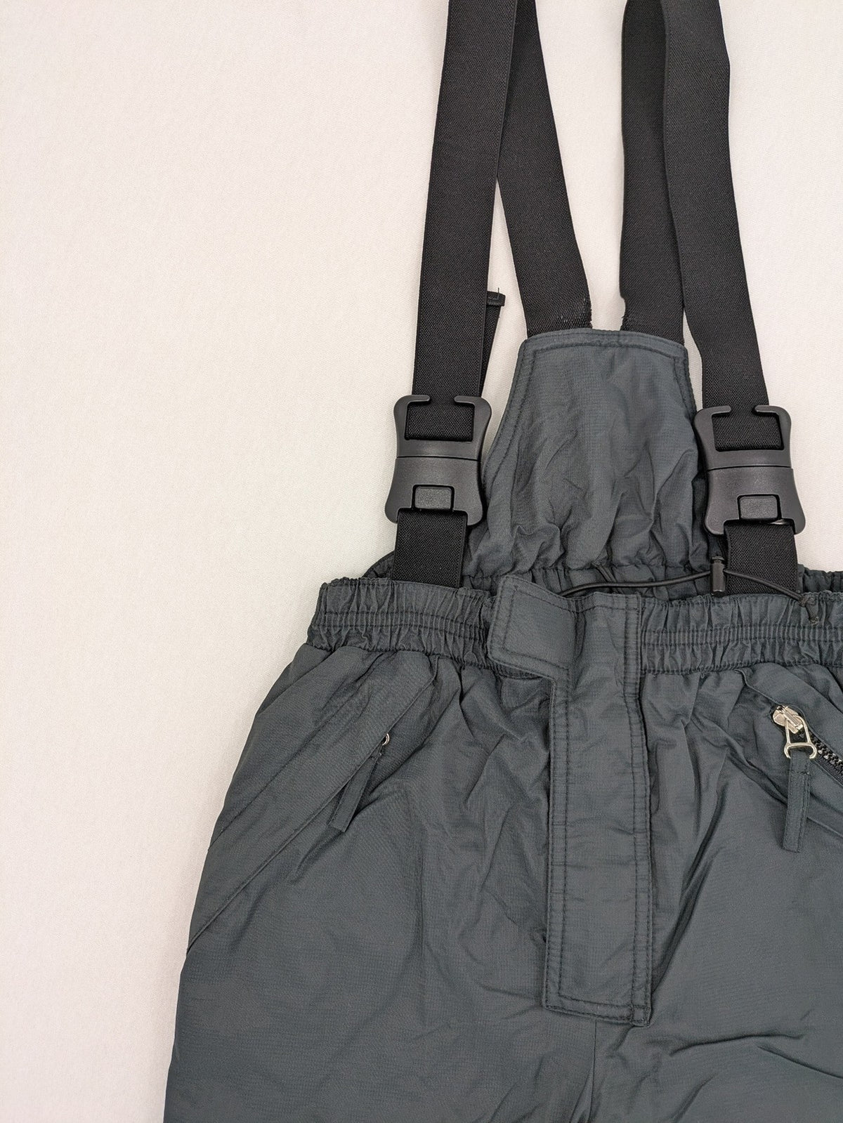 PROLINE grey winter ski pants with adjustable straps and insulated durable material.