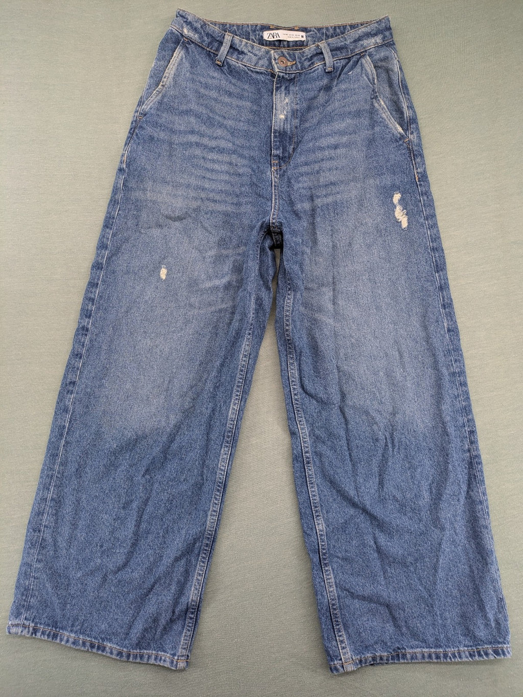 Zara blue wide leg jeans high rise with distressed details and 5-pocket design.