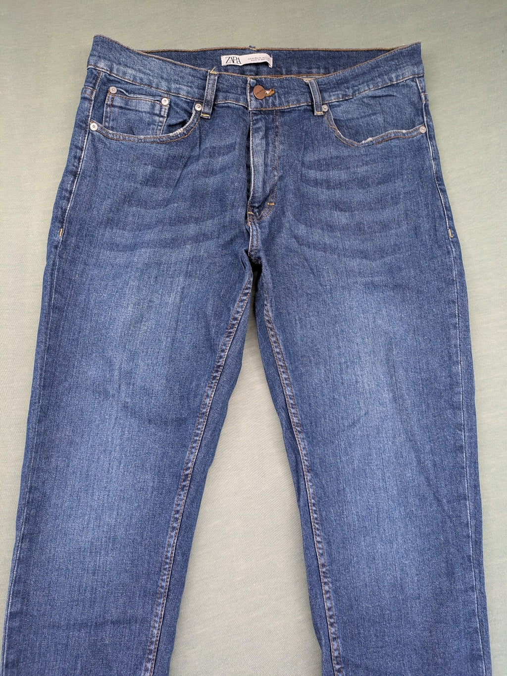 Zara blue straight jeans with medium wash, lightweight denim, and regular fit.