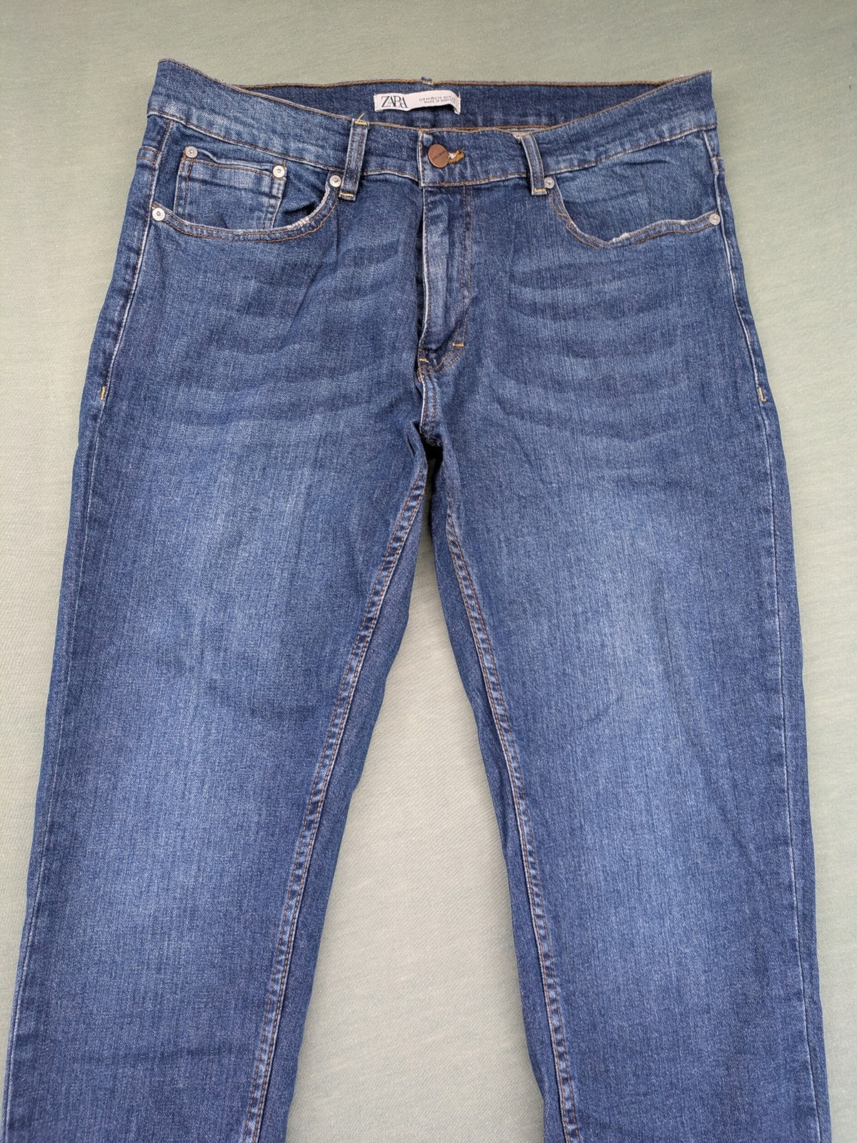 Zara blue straight jeans with medium wash, lightweight denim, and regular fit.