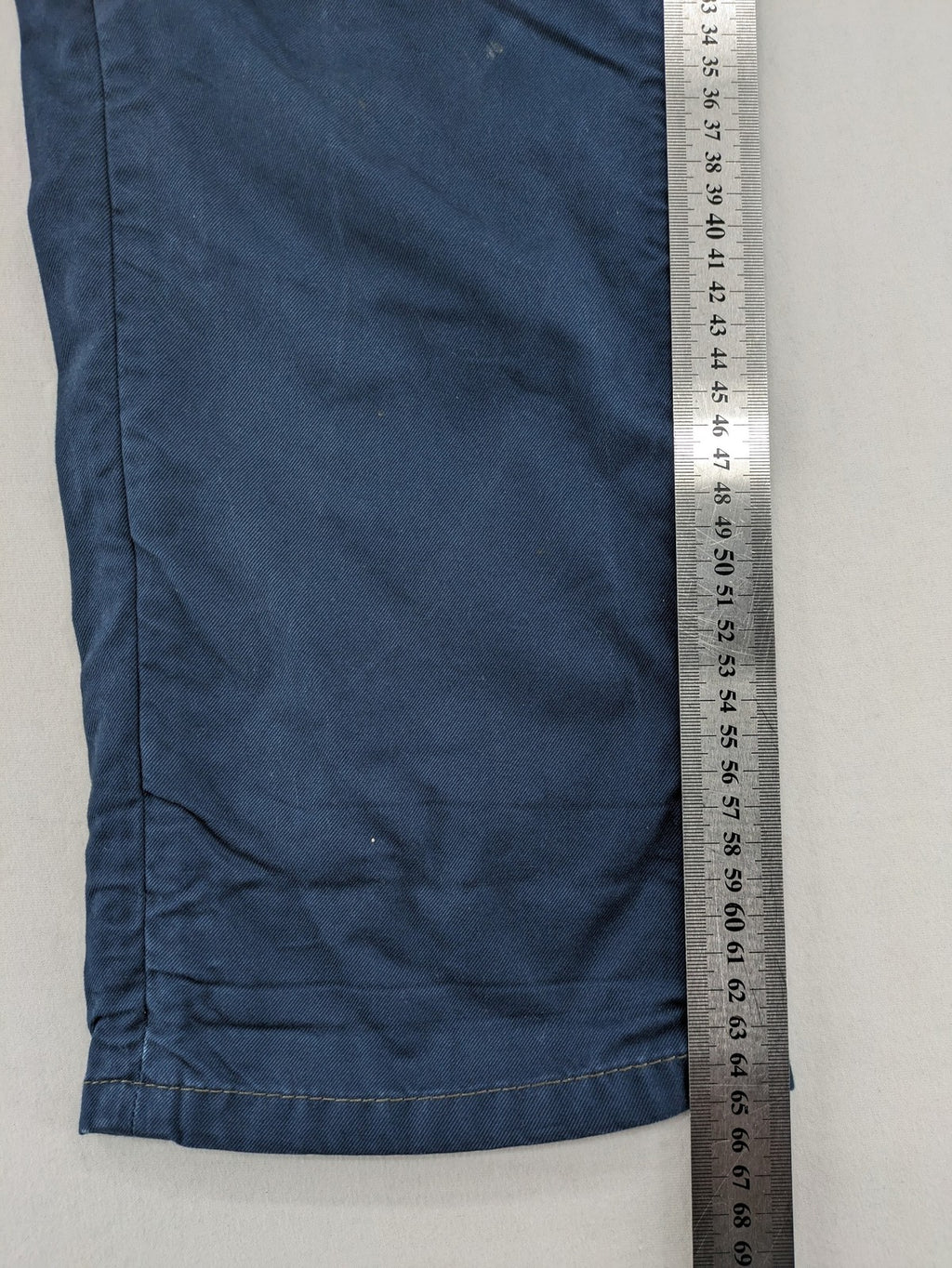 Marc O'Polo blue chino pants with button flap pockets and relaxed fit design.