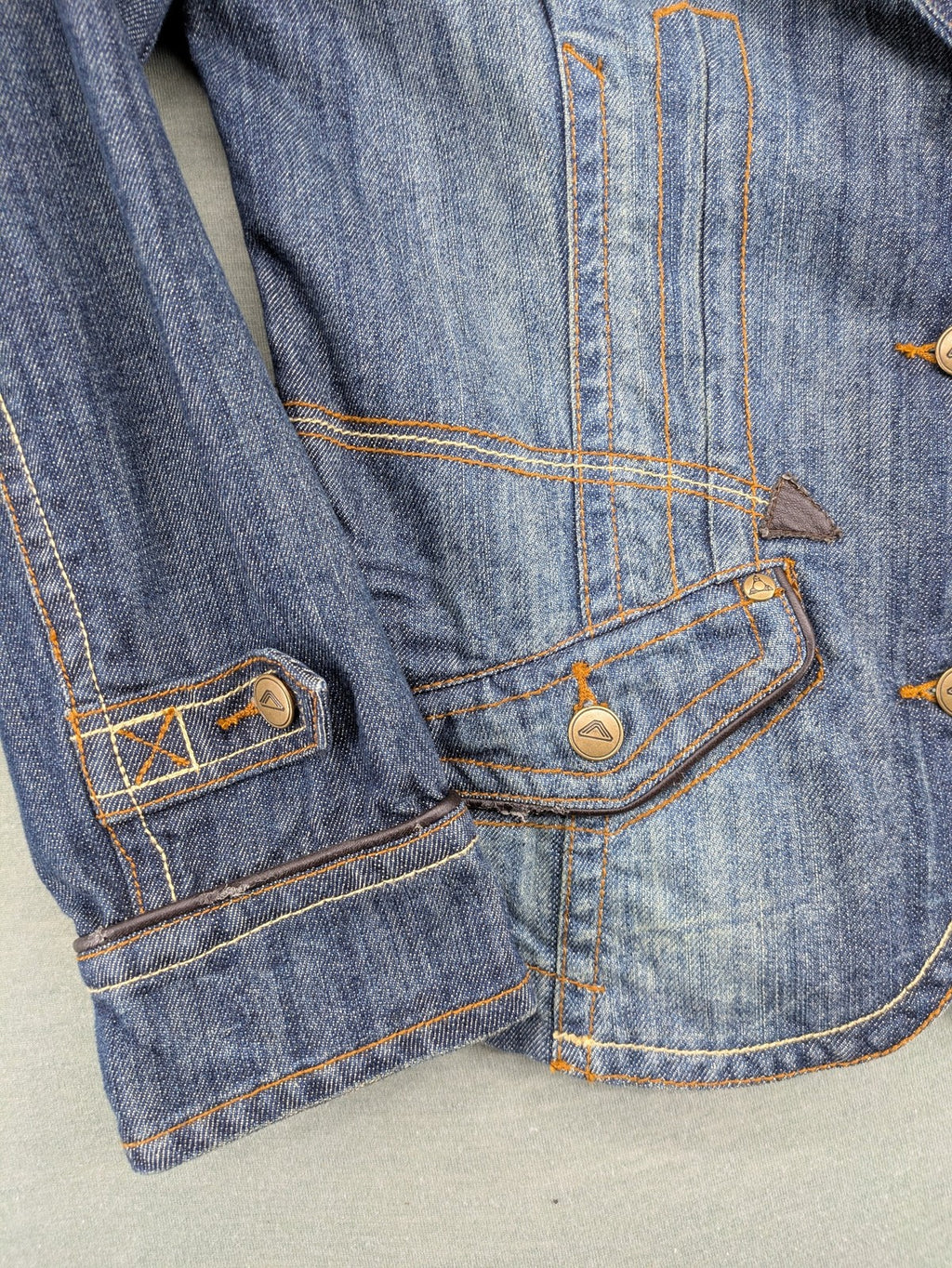 Authentic Clothing Company blue jeans blazer with contrast stitching and button closure.