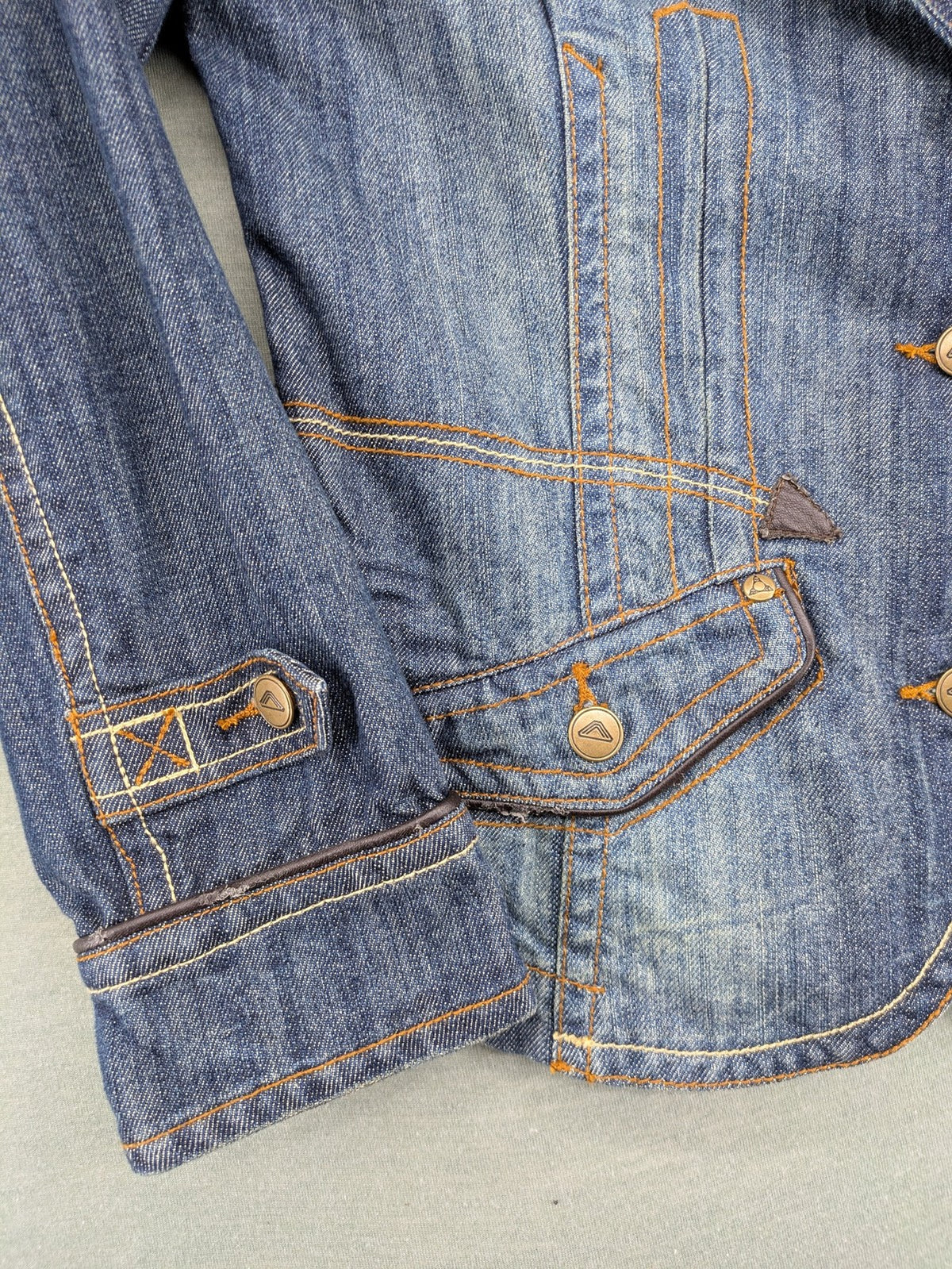 Authentic Clothing Company blue jeans blazer with contrast stitching and button closure.
