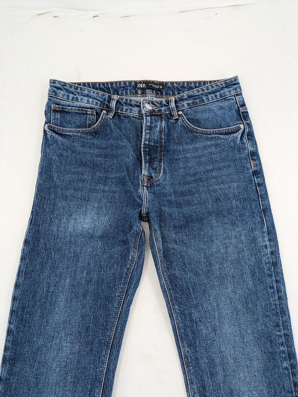 Zara blue straight jeans with classic 5-pocket design and button fly.