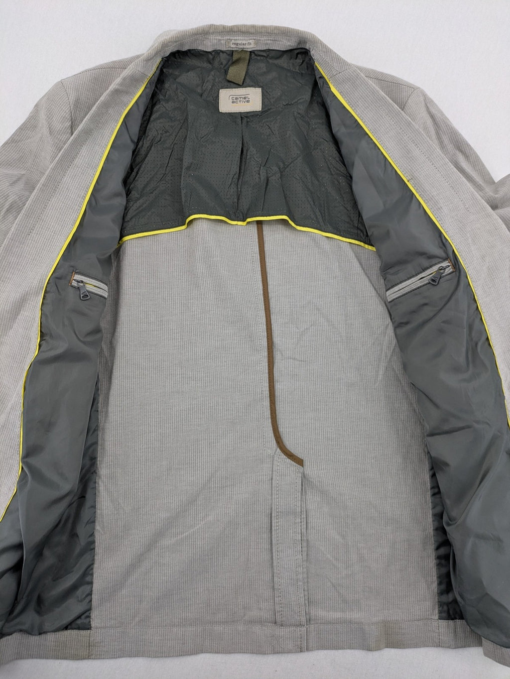 Camel Active grey cord blazer with classic two-button closure and practical zippered inner pockets.