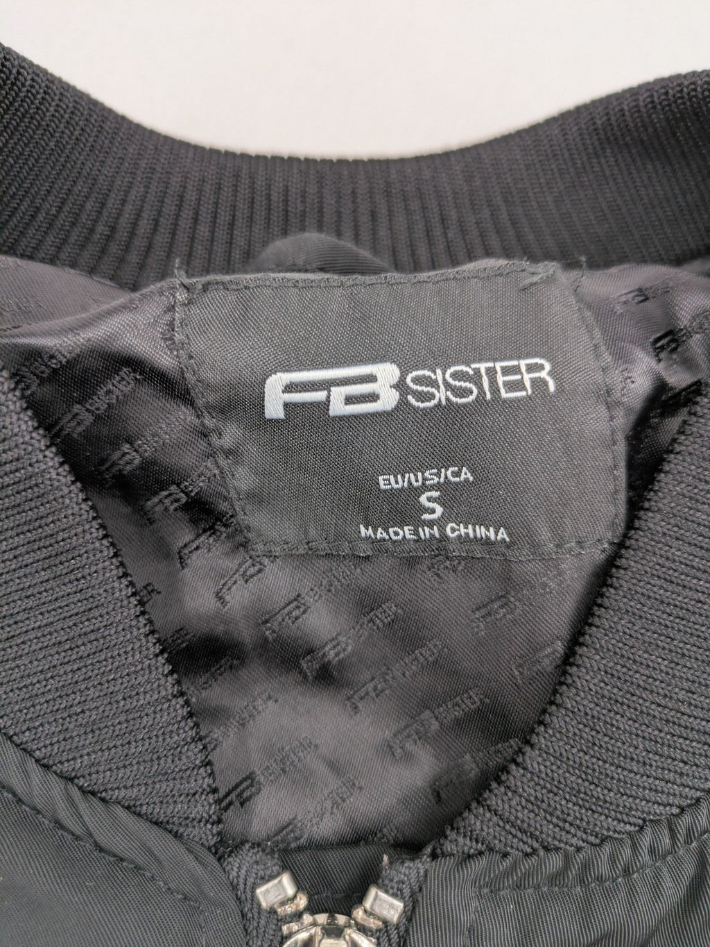 FB Sister grey bomber jacket with full zip, ribbed cuffs, and smooth polyester material.