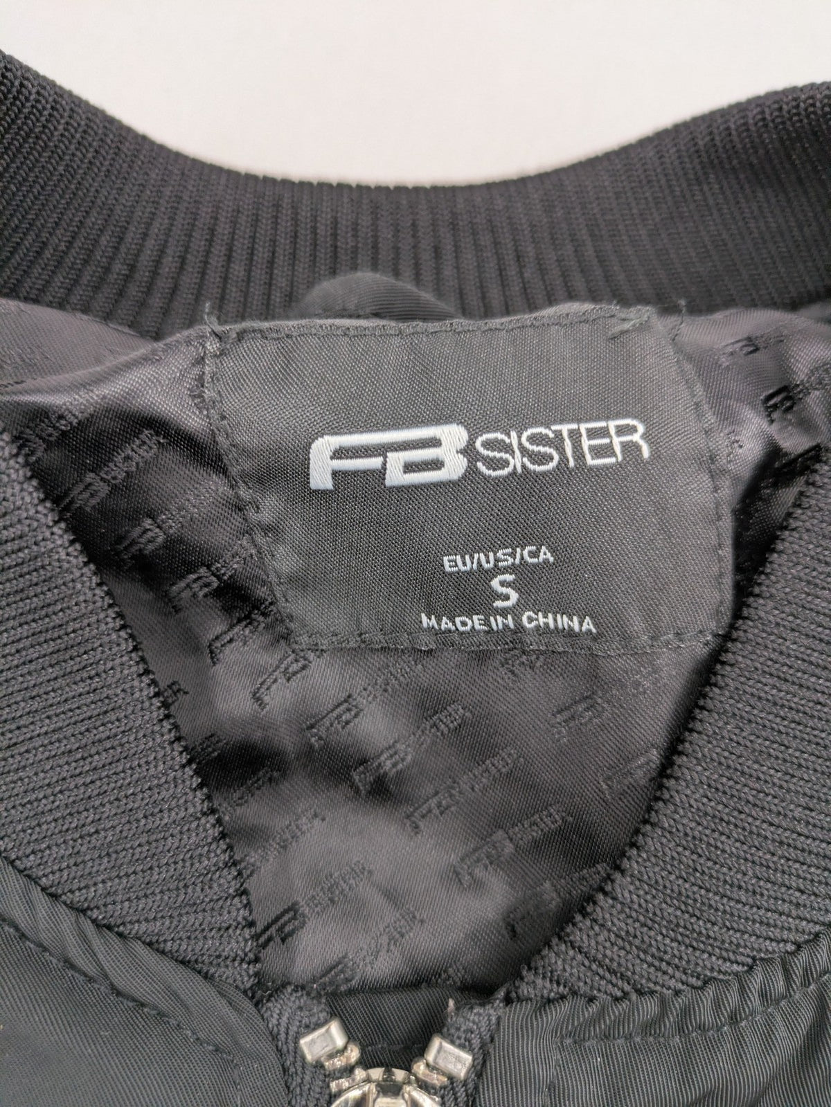 FB Sister grey bomber jacket with full zip, ribbed cuffs, and smooth polyester material.