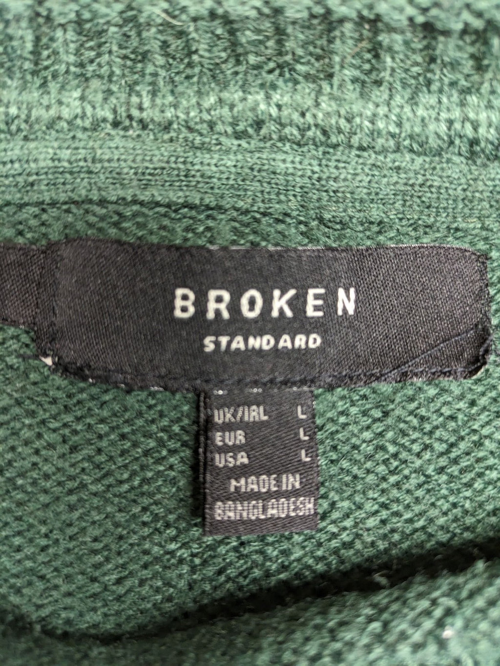 Broken Standard turtle neck jumper green waffle knit texture with classic round neckline.