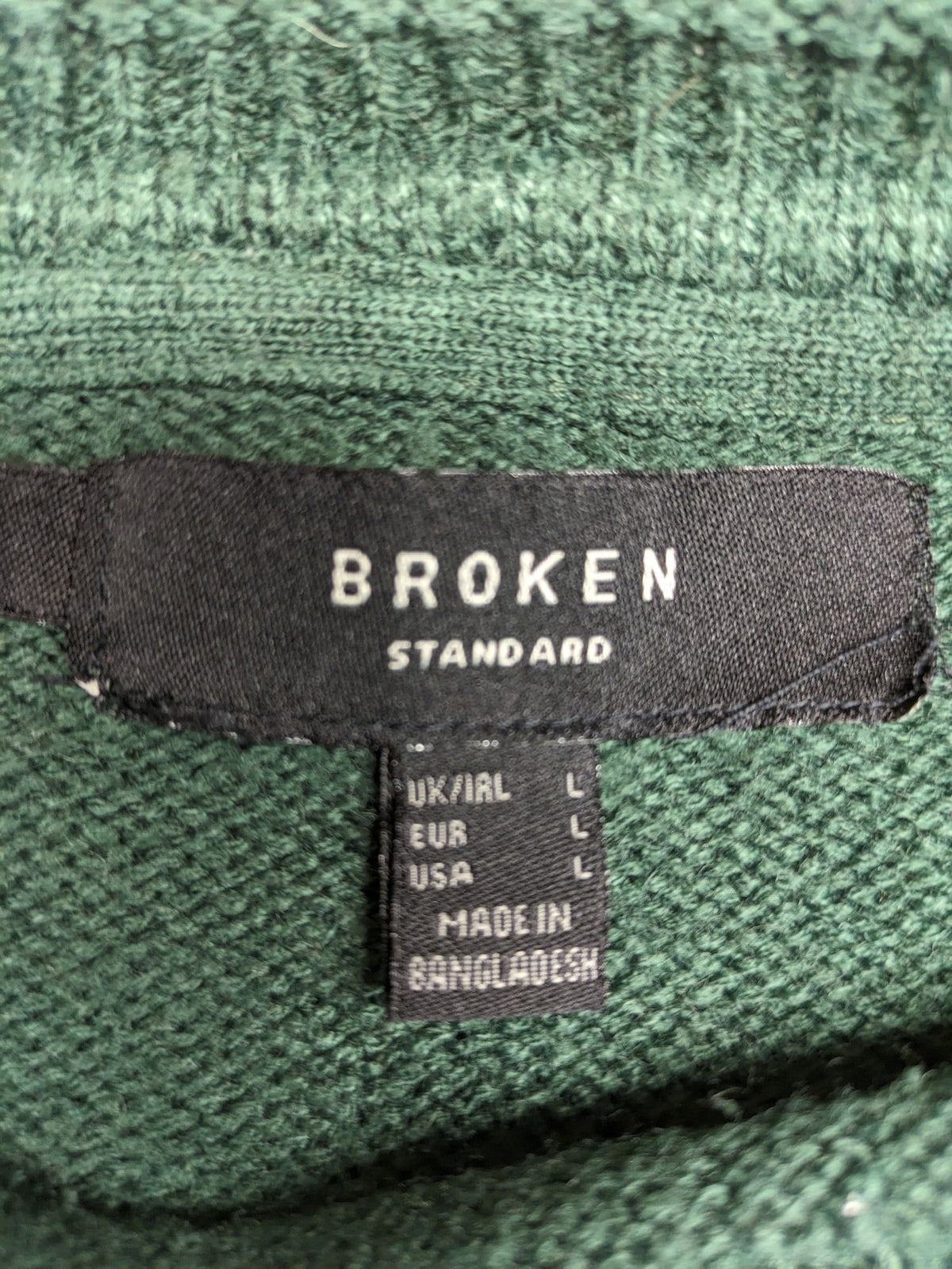 Broken Standard turtle neck jumper green waffle knit texture with classic round neckline.