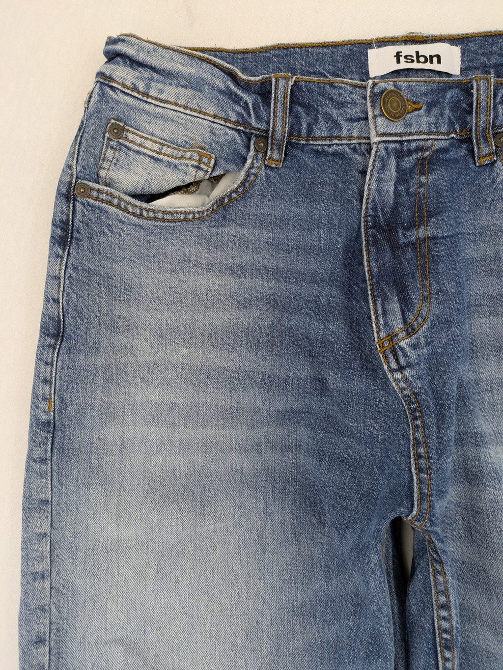 FSBN blue straight jeans with ripped distressed knees and classic button fly.