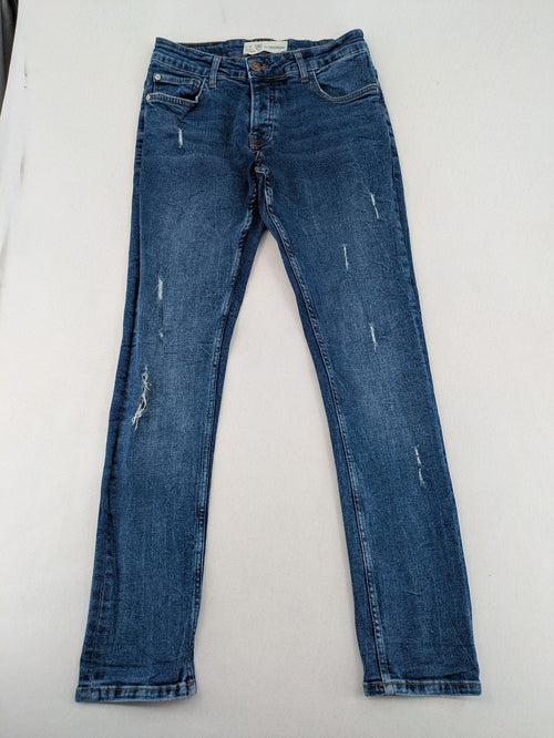 2Y Premium blue skinny jeans with distressed details and classic button fly.