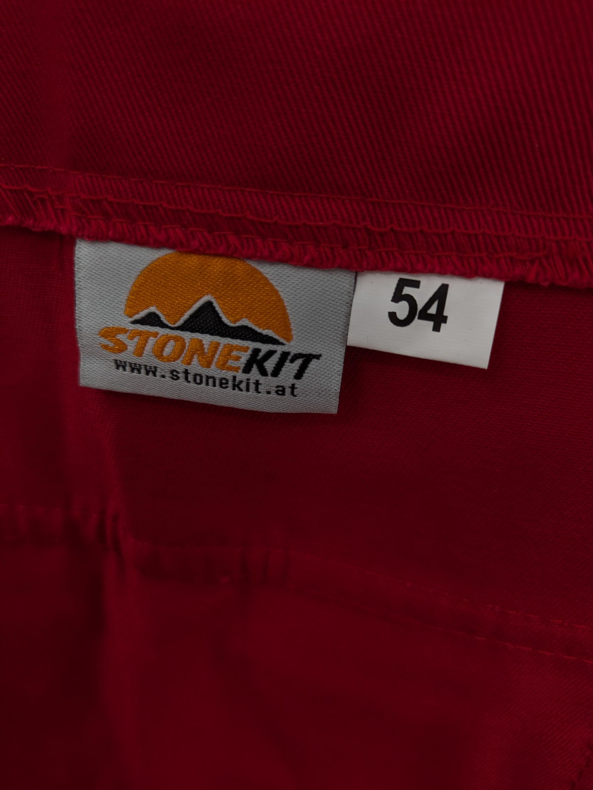 Stonekit red work overalls cotton with adjustable straps and multiple cargo pockets.