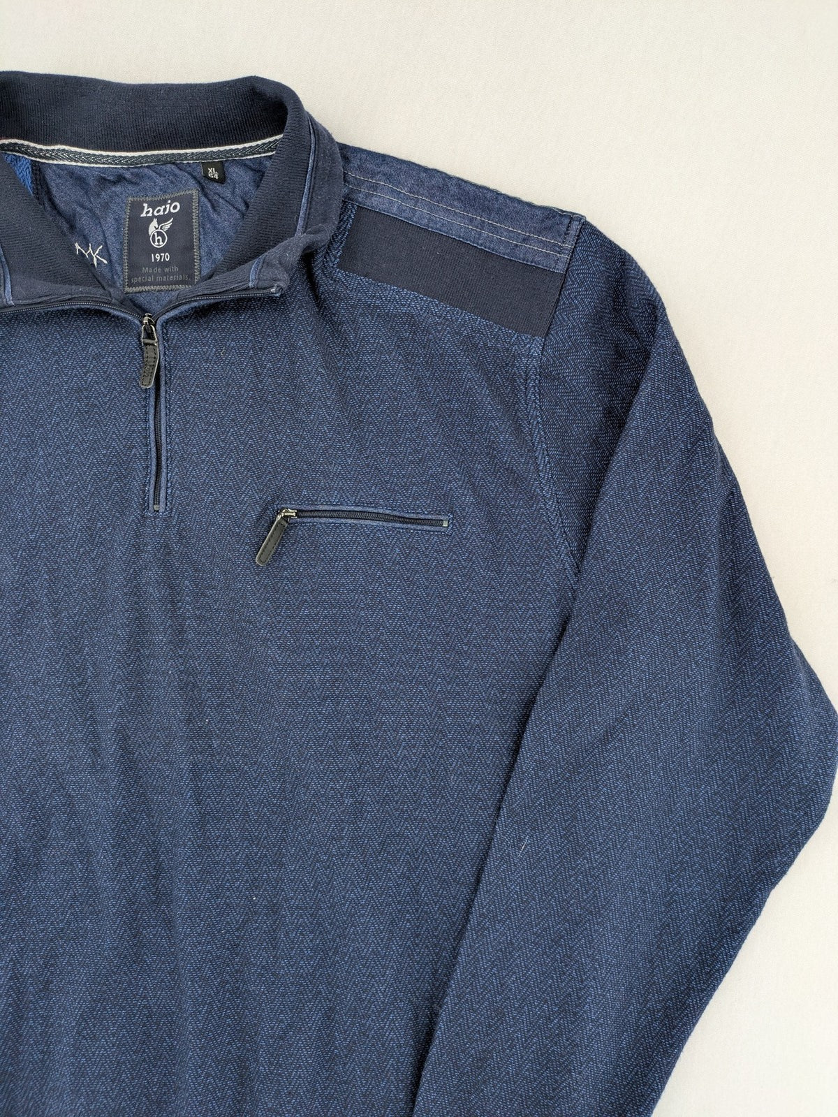 Hajo navy turtle neck jumper with herringbone pattern, zip collar, and chest pocket.