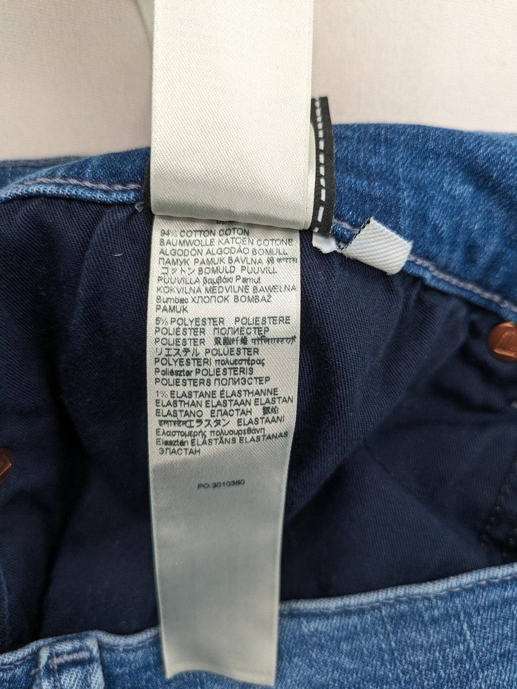7 For All Mankind blue straight jeans with 5-pocket design and logo on back pocket.