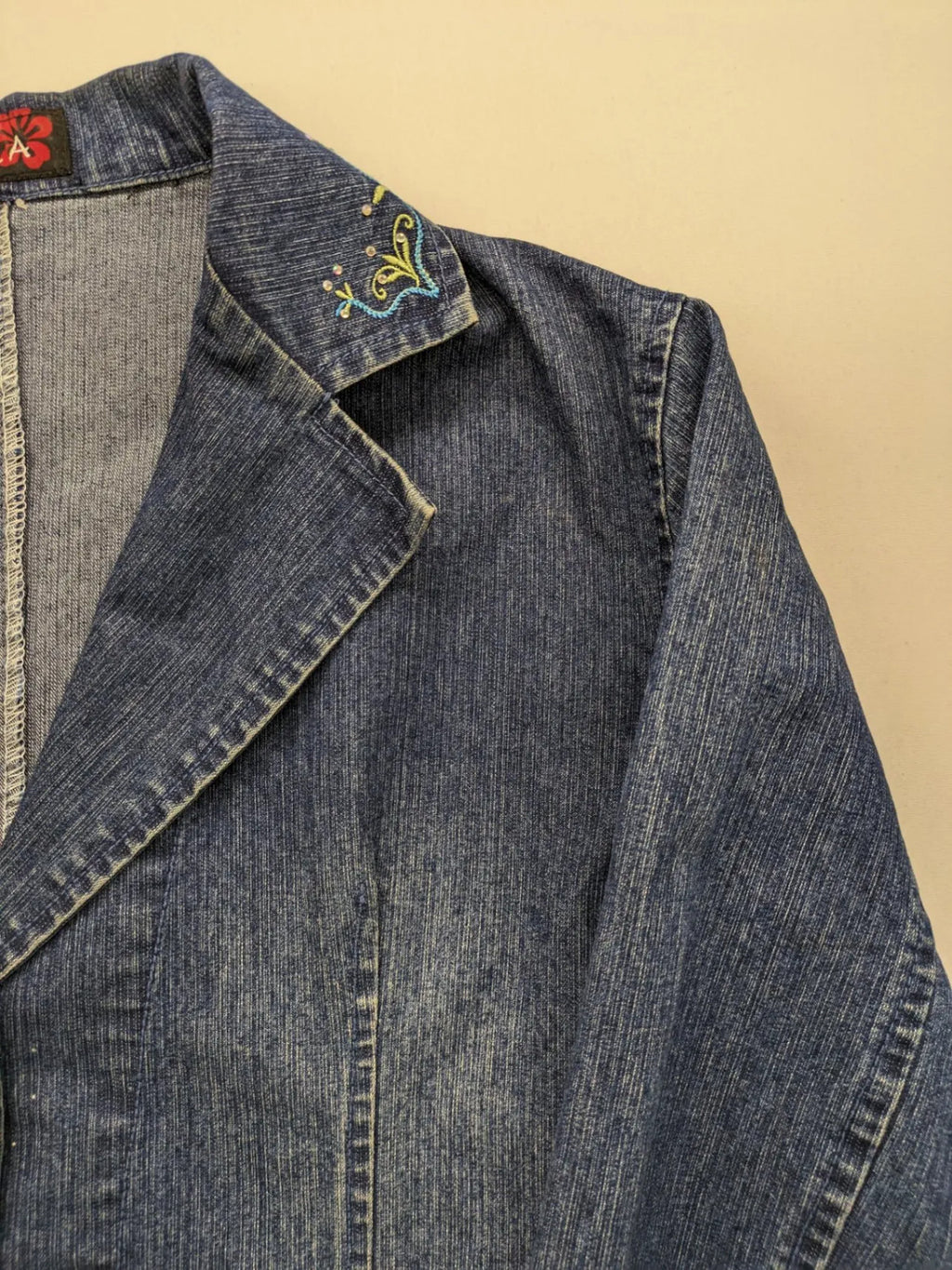 Zala blue denim blazer jacket with embroidered details and classic button closure.