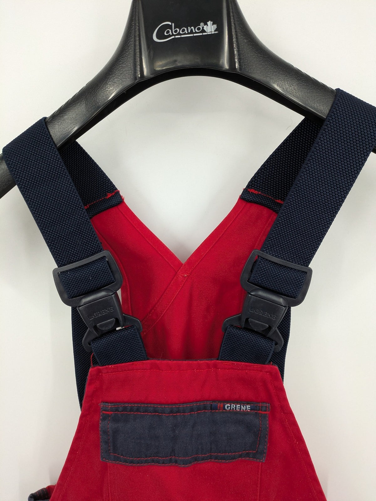 Grene navy red overall with adjustable straps, multiple pockets, and durable material.