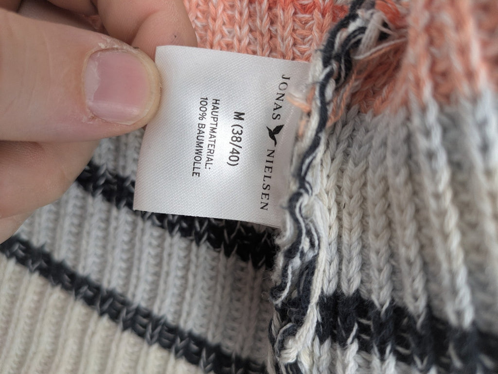Jonas multi turtle neck jumper with striped pattern and open front design.