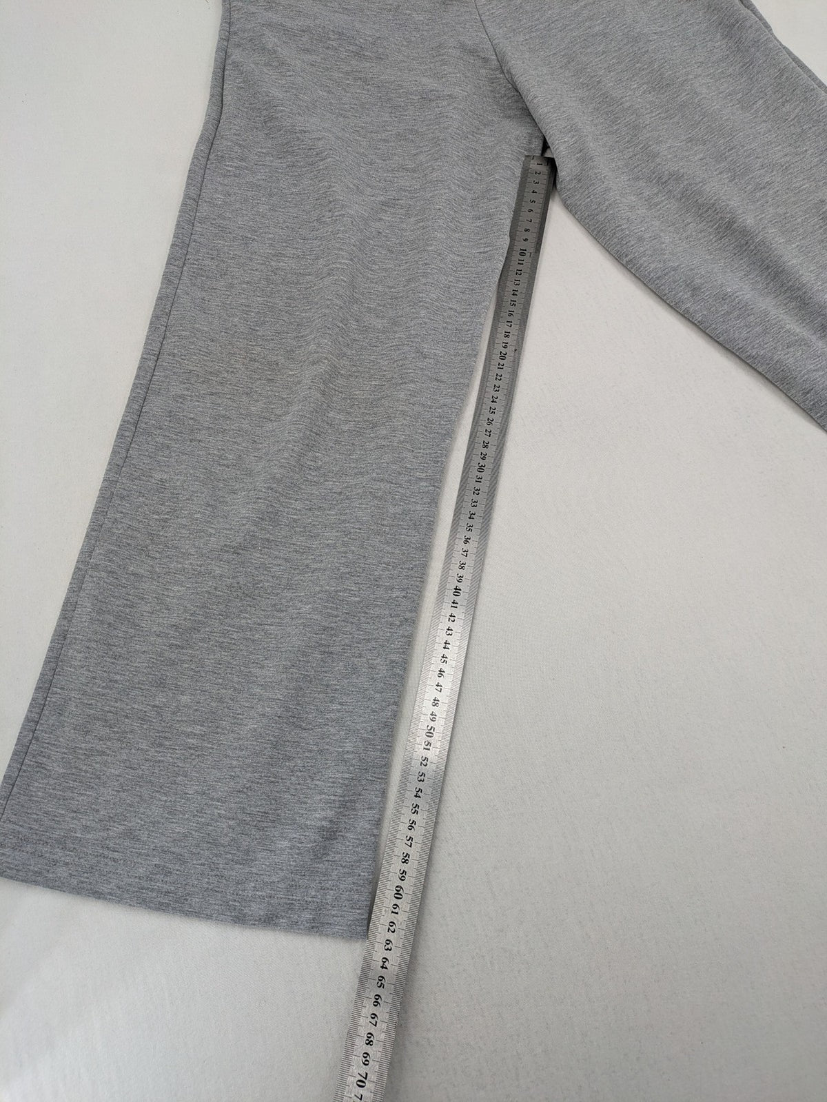 Falconhill grey jogging pants with elastic waistband, drawstring, and stylish black accent pockets.