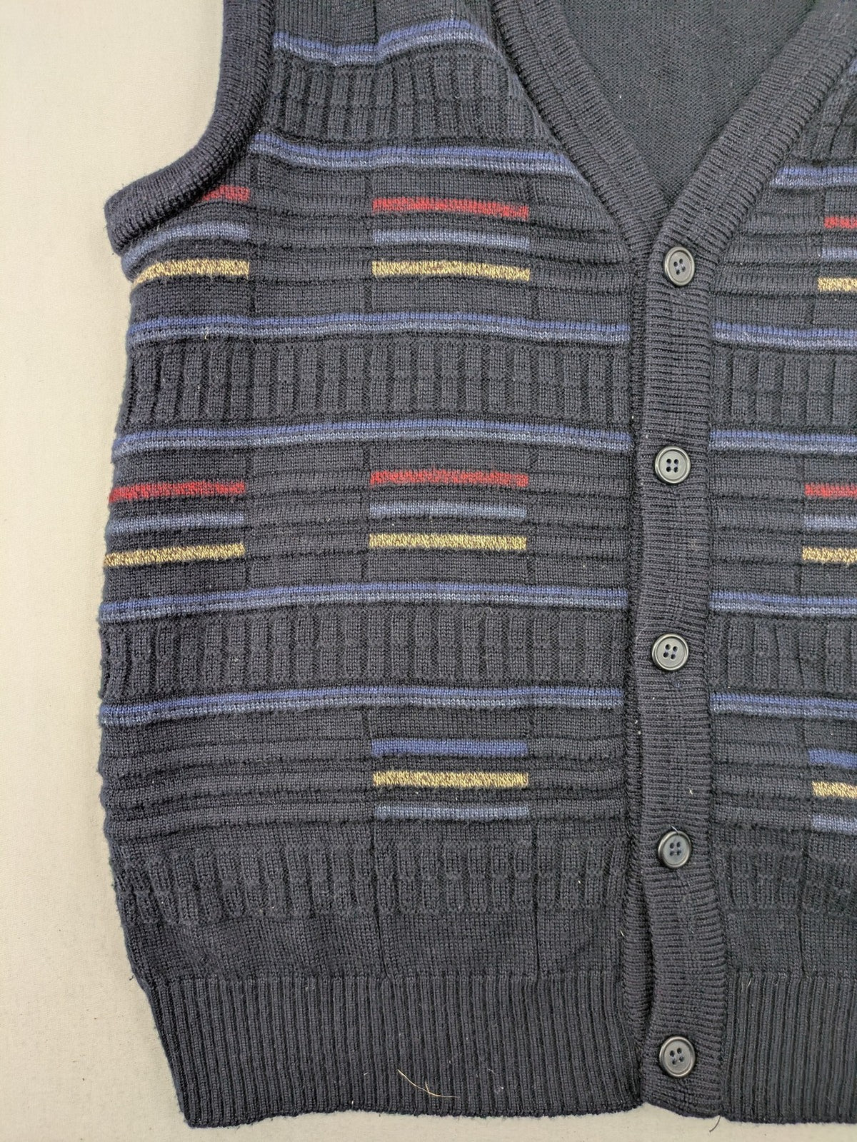 Via Cortesa gold turtle neck jumper with structured pattern and V-neck design.