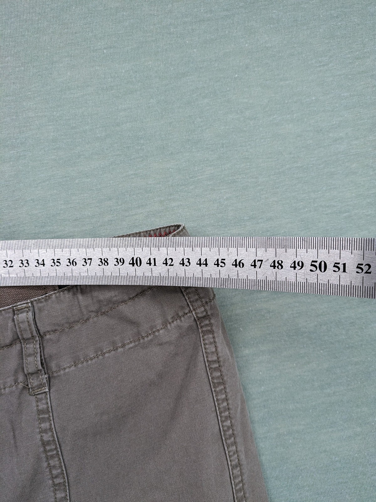 Columbia grey cargo pants with multiple pockets and drawstring waist, 100% cotton.