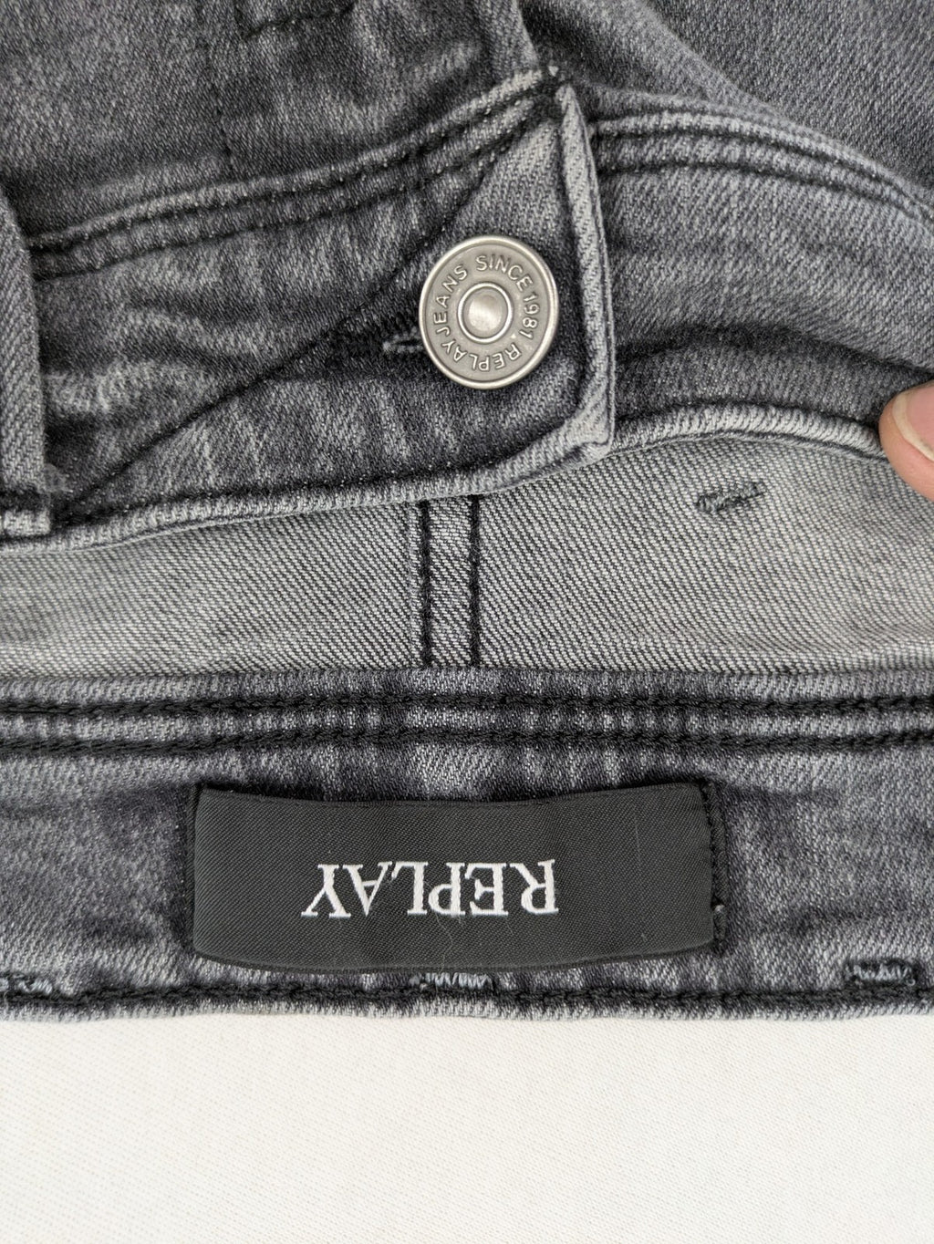 Replay grey straight jeans faded wash five-pocket style with logo on pocket.