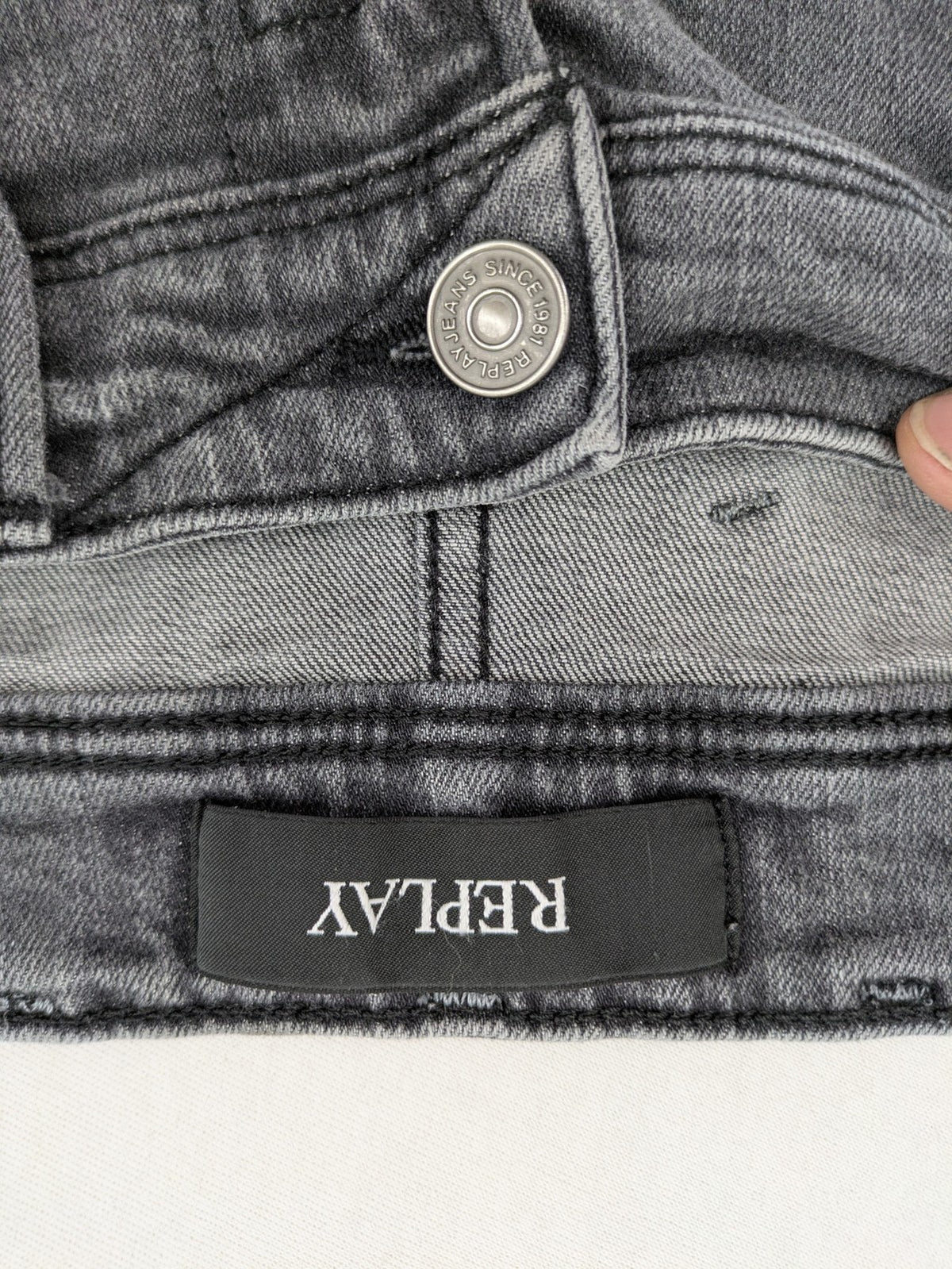 Replay grey straight jeans faded wash five-pocket style with logo on pocket.