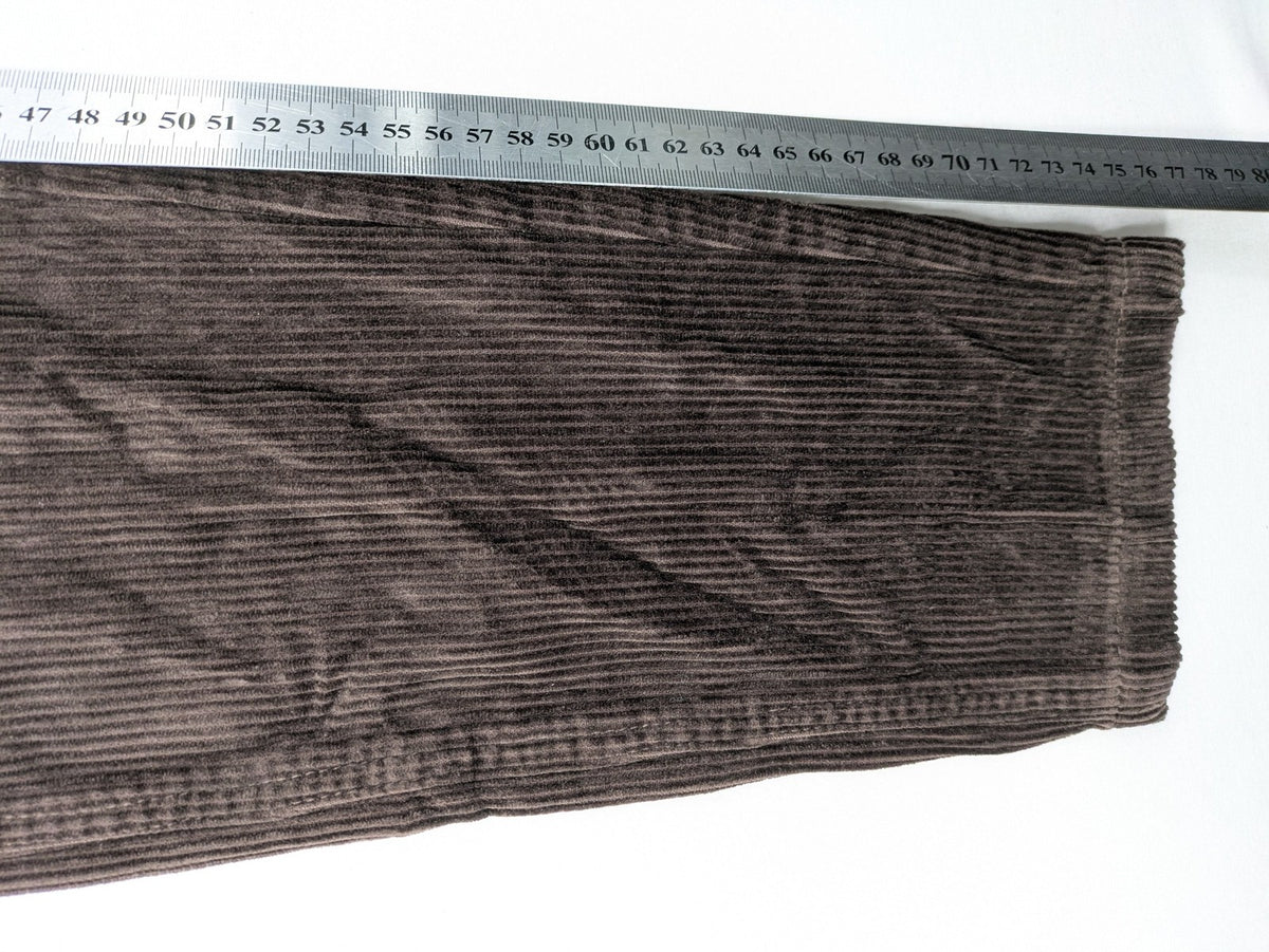 Alma & Lovis brown cord pants with drawstring, casual fit, and patch pockets.