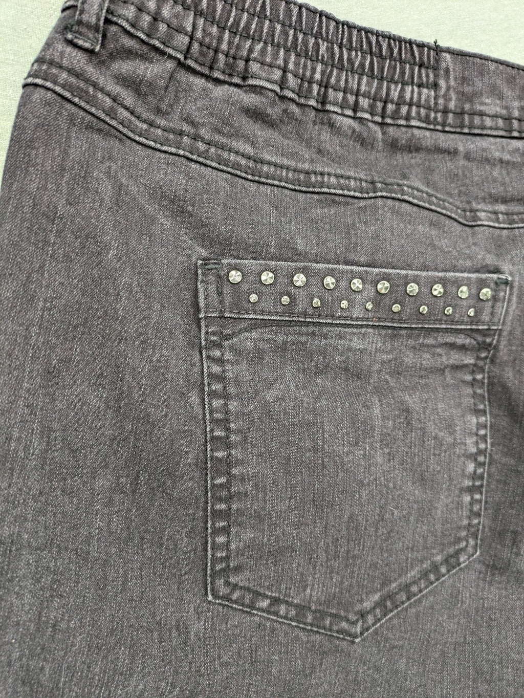 Charles Vögele grey straight jeans with elastic waistband and decorative studs on pockets.