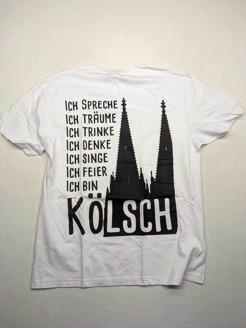 JHK black t-shirt with red "Kölsche Jung" text and Cologne Cathedral graphic.