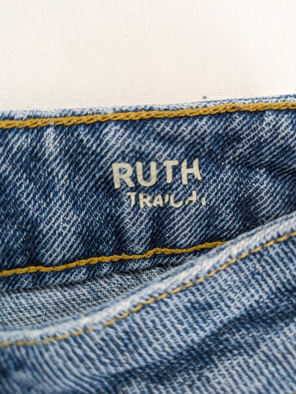 Castro Jeans blue straight leg jeans high waist with white paint splatter details.