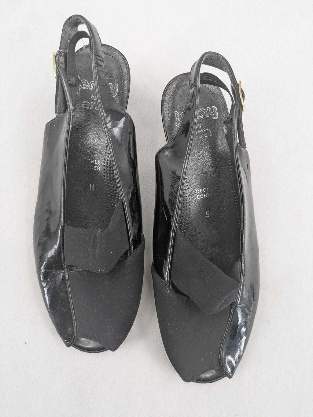 Jenny by Ara black slingback pumps with peep-toe front and glossy finish.