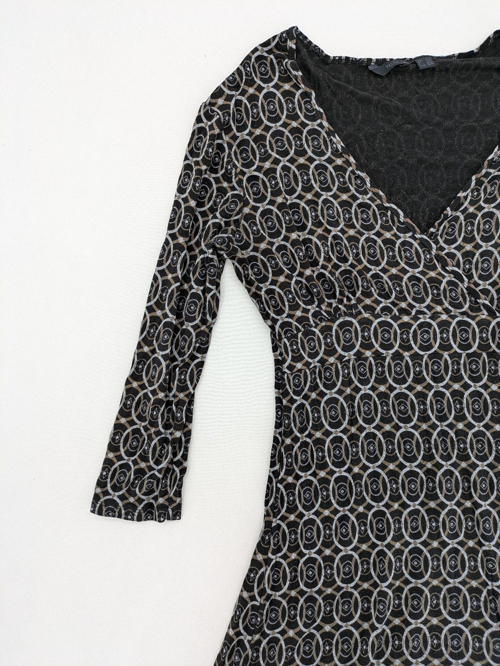 TCM pink wrap dress with V-neck, 3/4 sleeves, geometric black, white, and brown pattern.