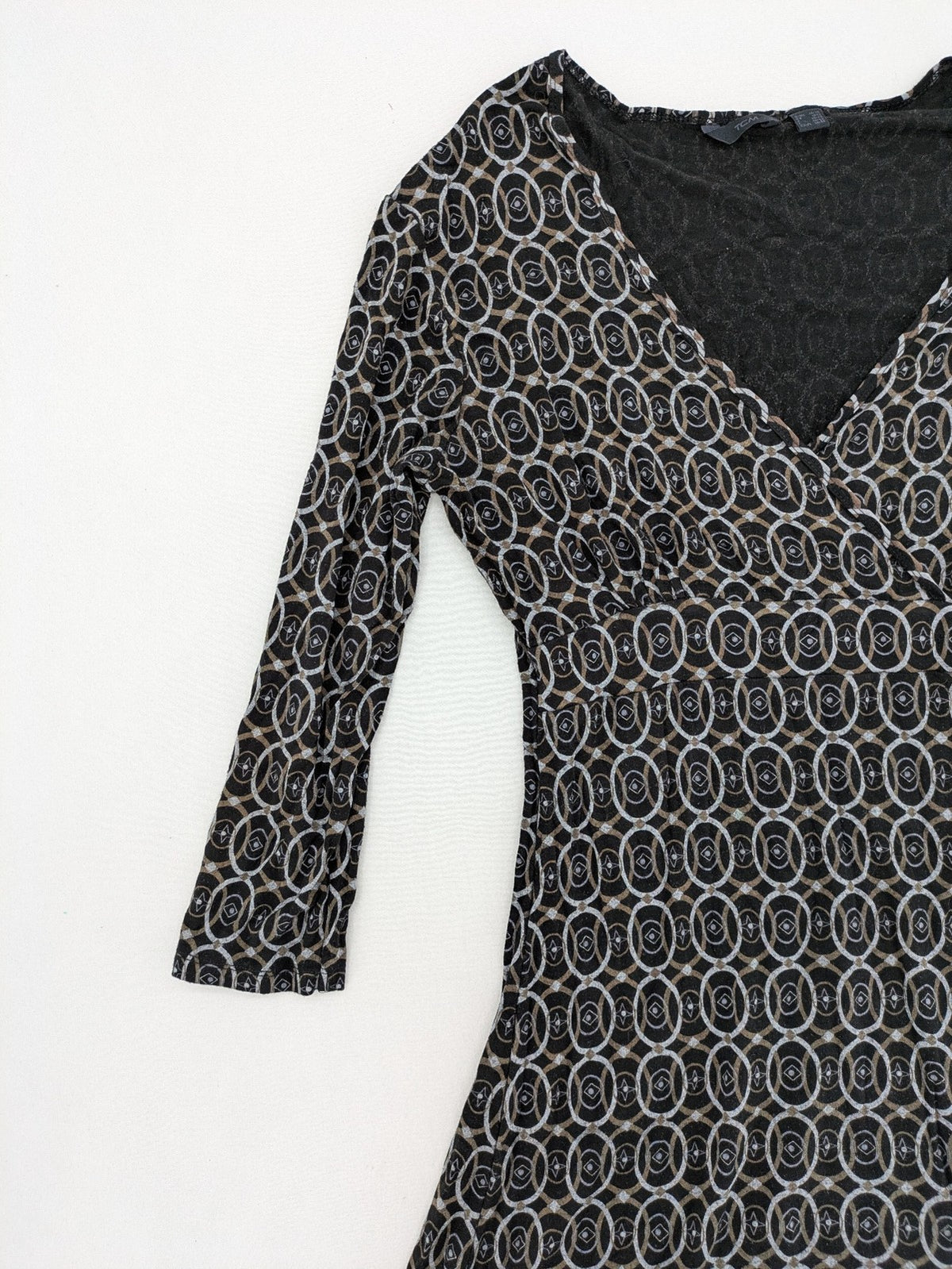 TCM pink wrap dress with V-neck, 3/4 sleeves, geometric black, white, and brown pattern.