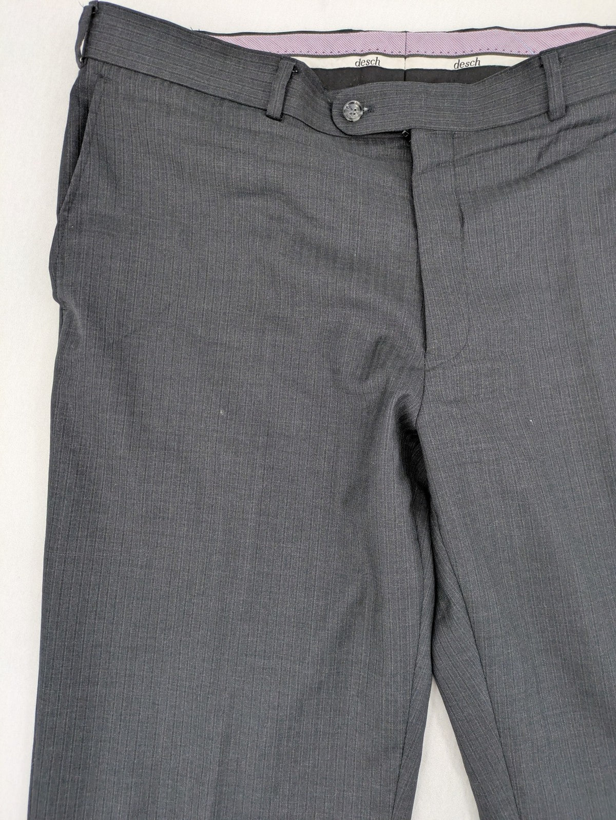 Desch grey suit pants with subtle pinstripe pattern and flat front design.
