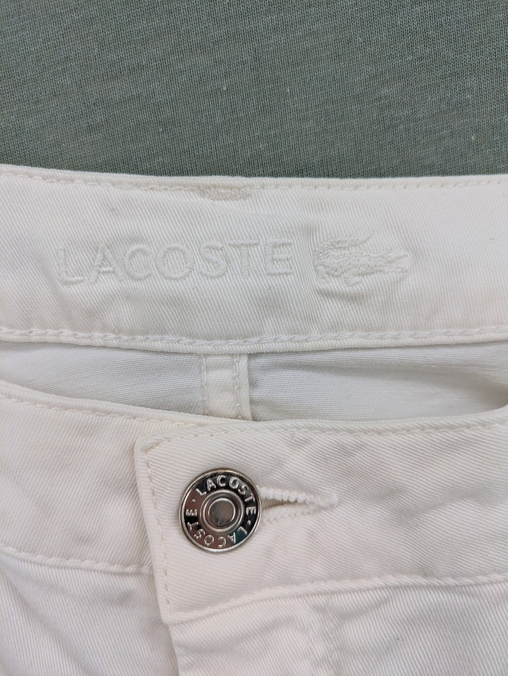 Lacoste white straight jeans high rise slim fit with logo and stretch denim material.