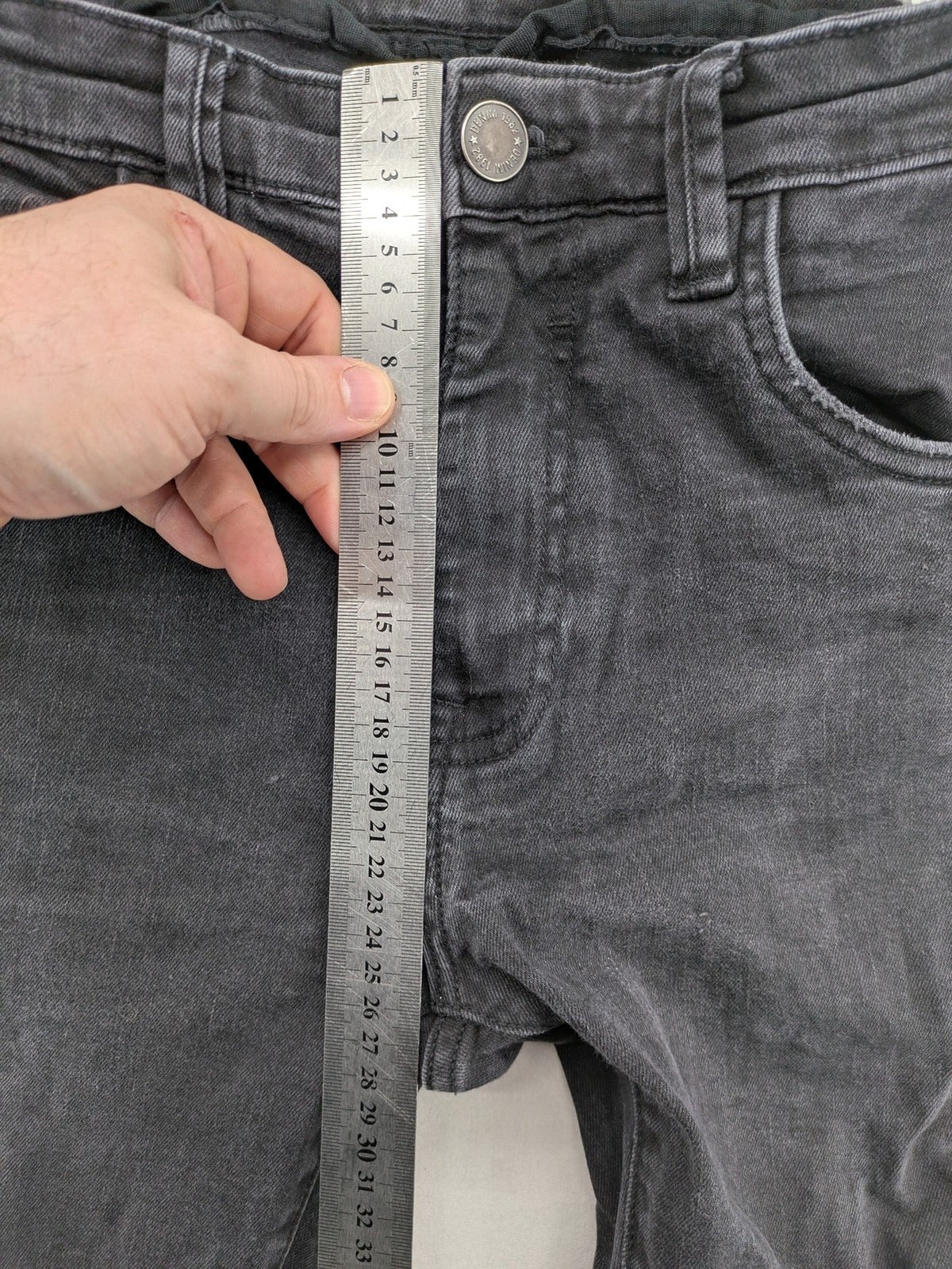 Denim 1982 grey slim fit jeans with ripped knee detail and distressed finish.