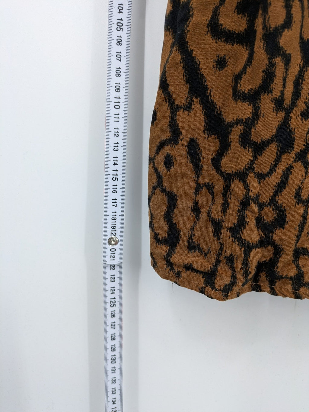 H&M brown and black animal print midi dress with smocked bodice and square neckline.