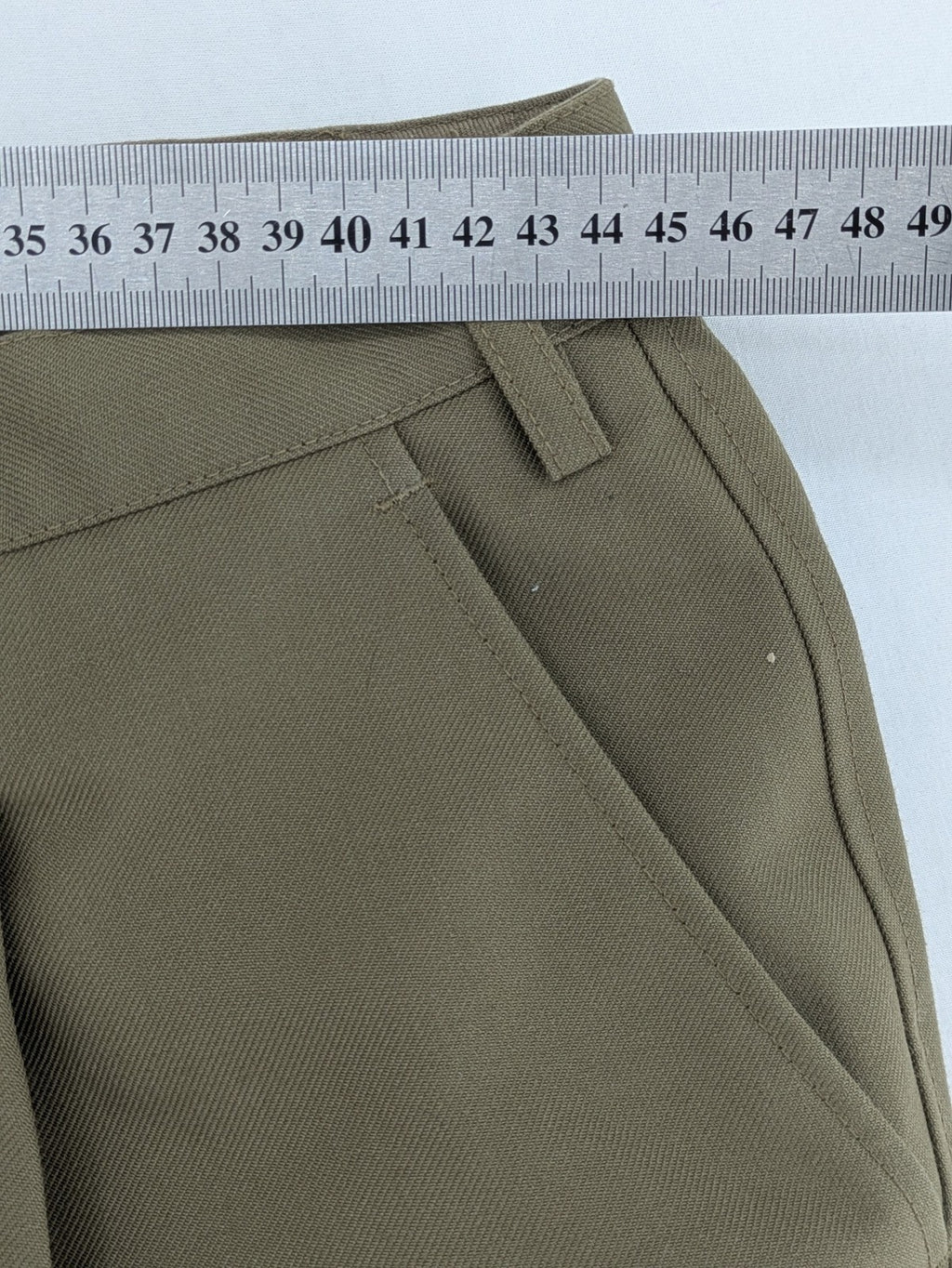 Bundeswehr khaki military uniform trousers with front pleats, zipper, and belt loops.
