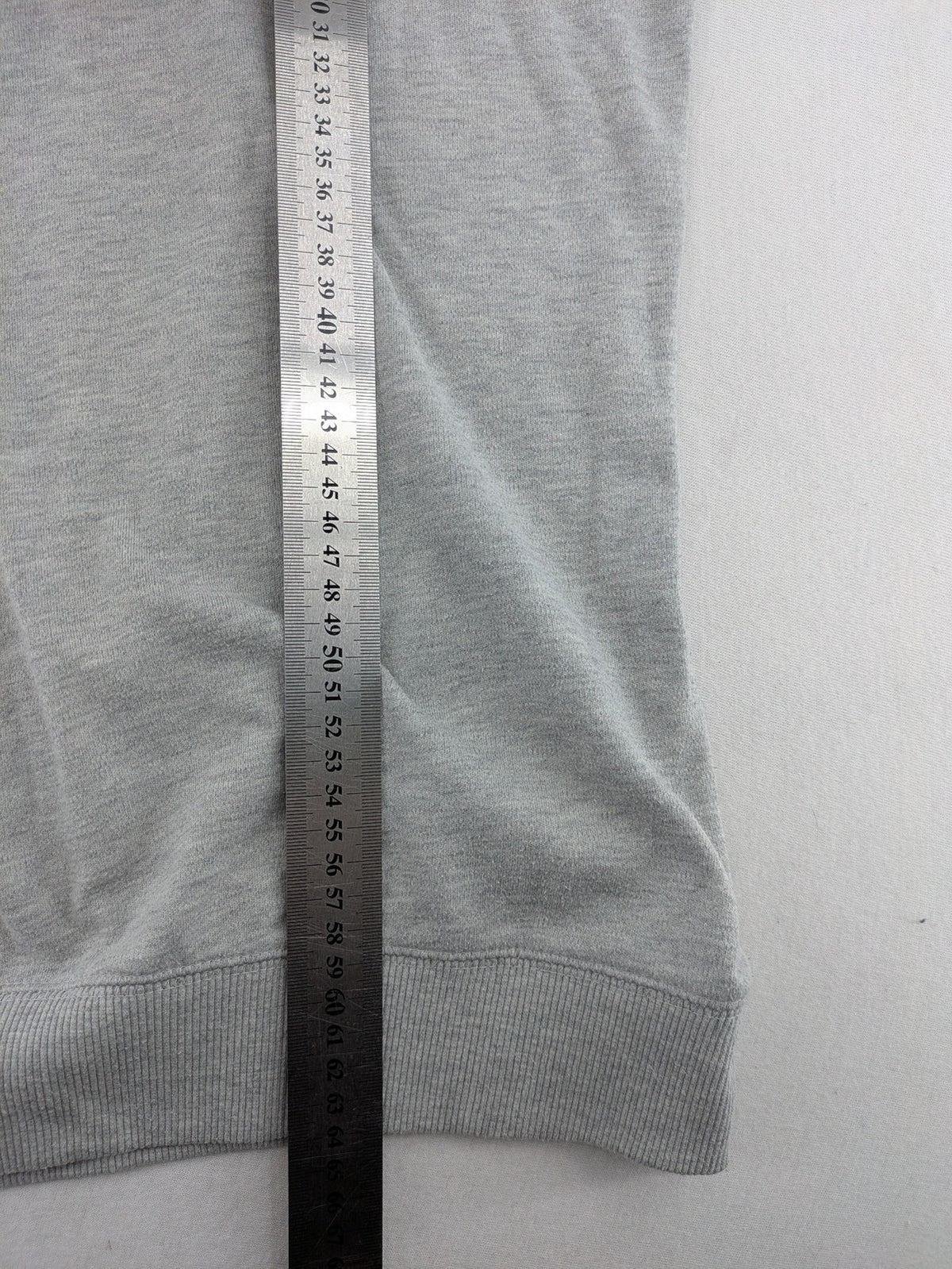 Colours Of The World grey knit jumper with pink drawstring, inspirational graphic print, soft material.