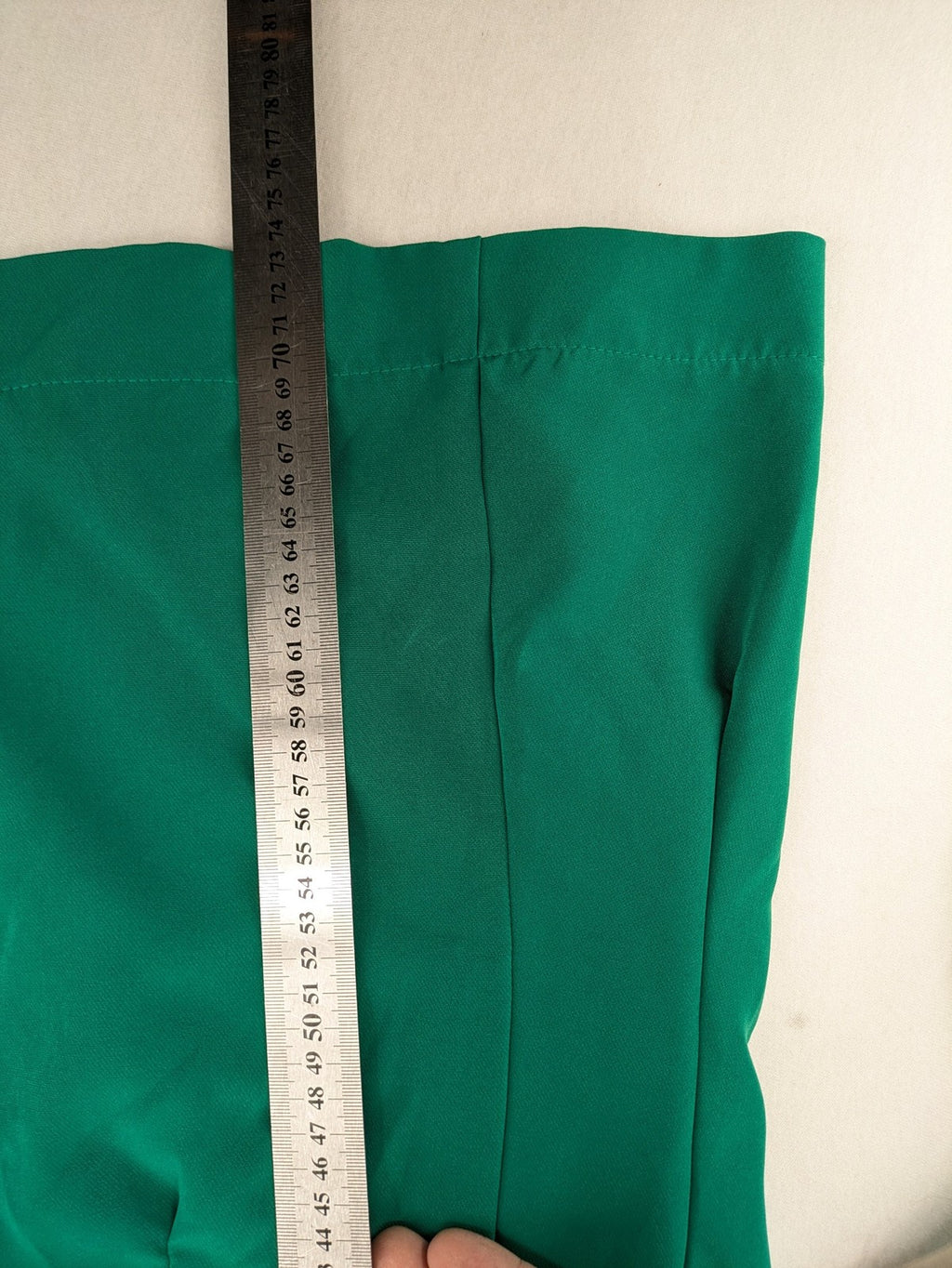 Promiss green blazer jacket single-button design with notch lapels and decorative pockets.