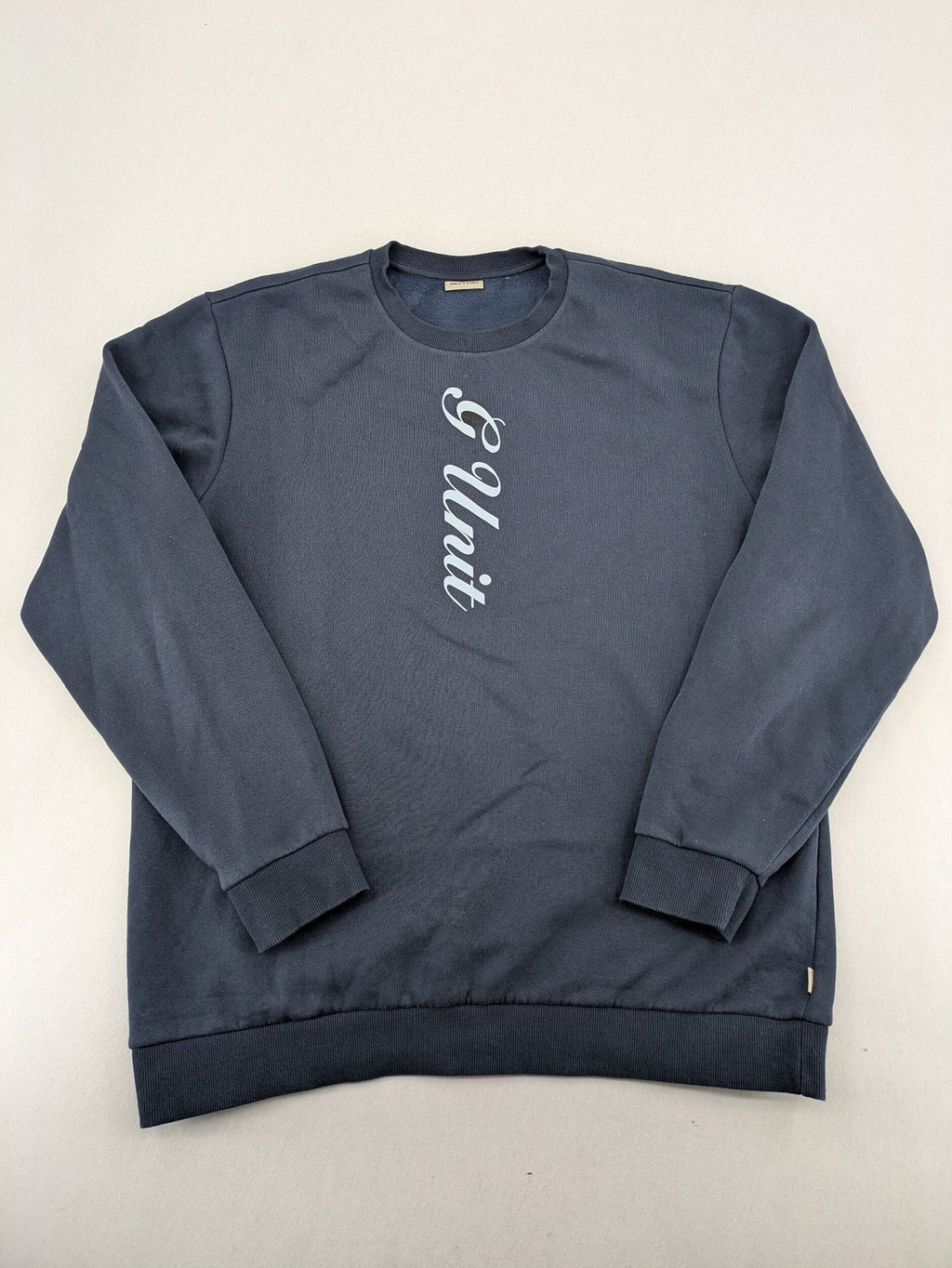 G-Unit navy turtle neck jumper with vertical logo graphic and soft fleece interior.