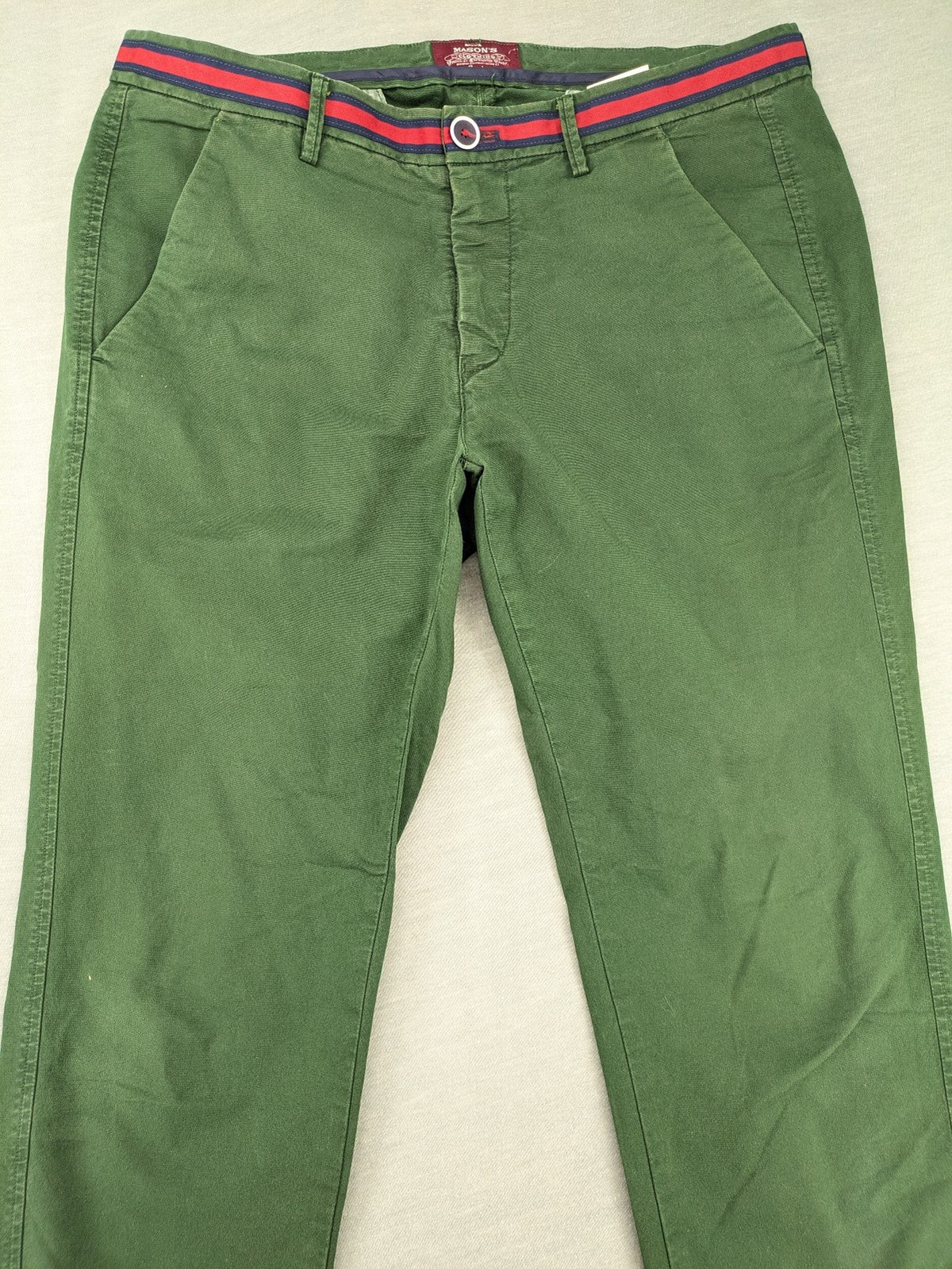 Mason's green chino pants with striped red and blue waistband, cotton stretch material.