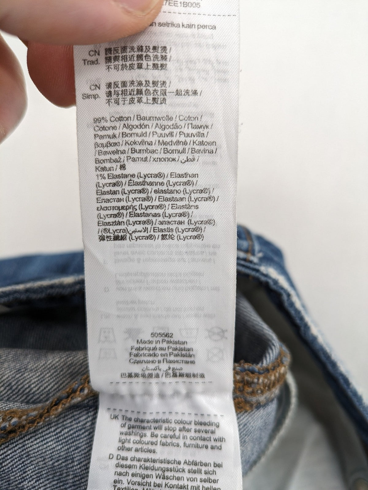Esprit blue straight leg jeans with ripped knee details and rolled hem.
