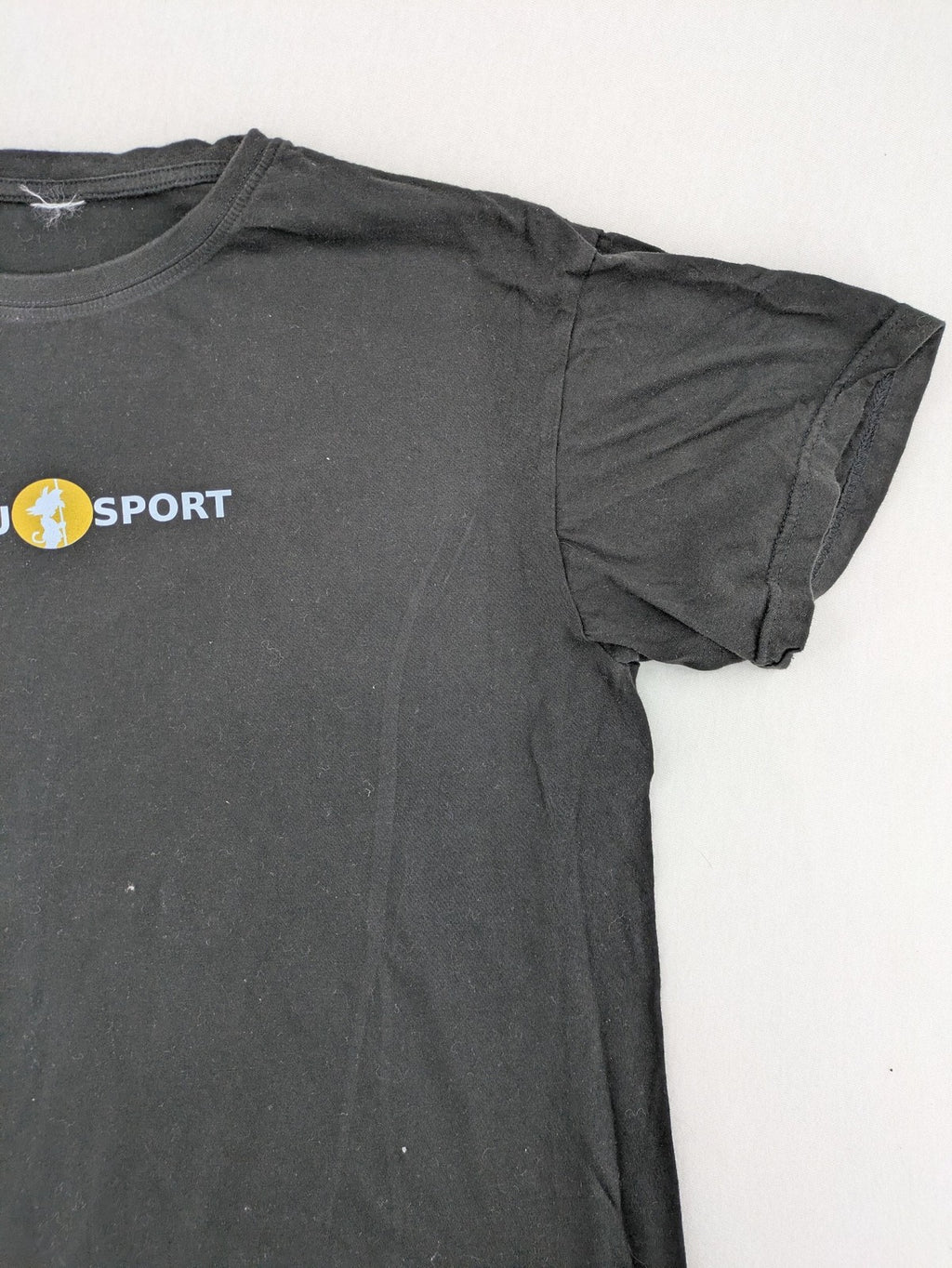 Dragon Ball Z black t-shirt featuring Goku Sport logo and silhouette on Flying Nimbus.